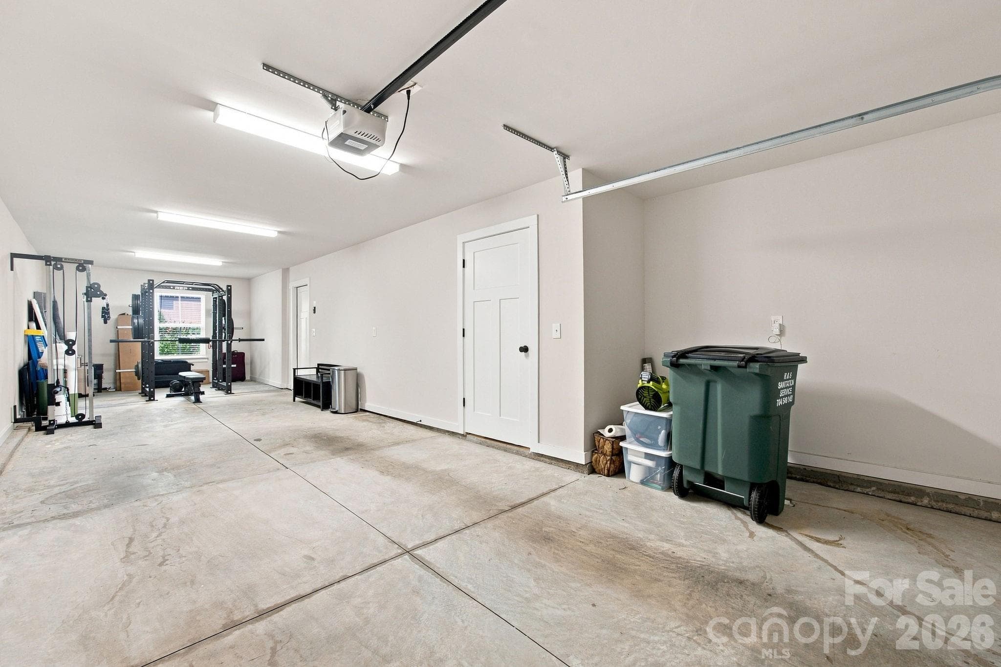 Tandem garage with storage closet and access to first floor. - 2303 Rozzelles Ferry Road, Charlotte