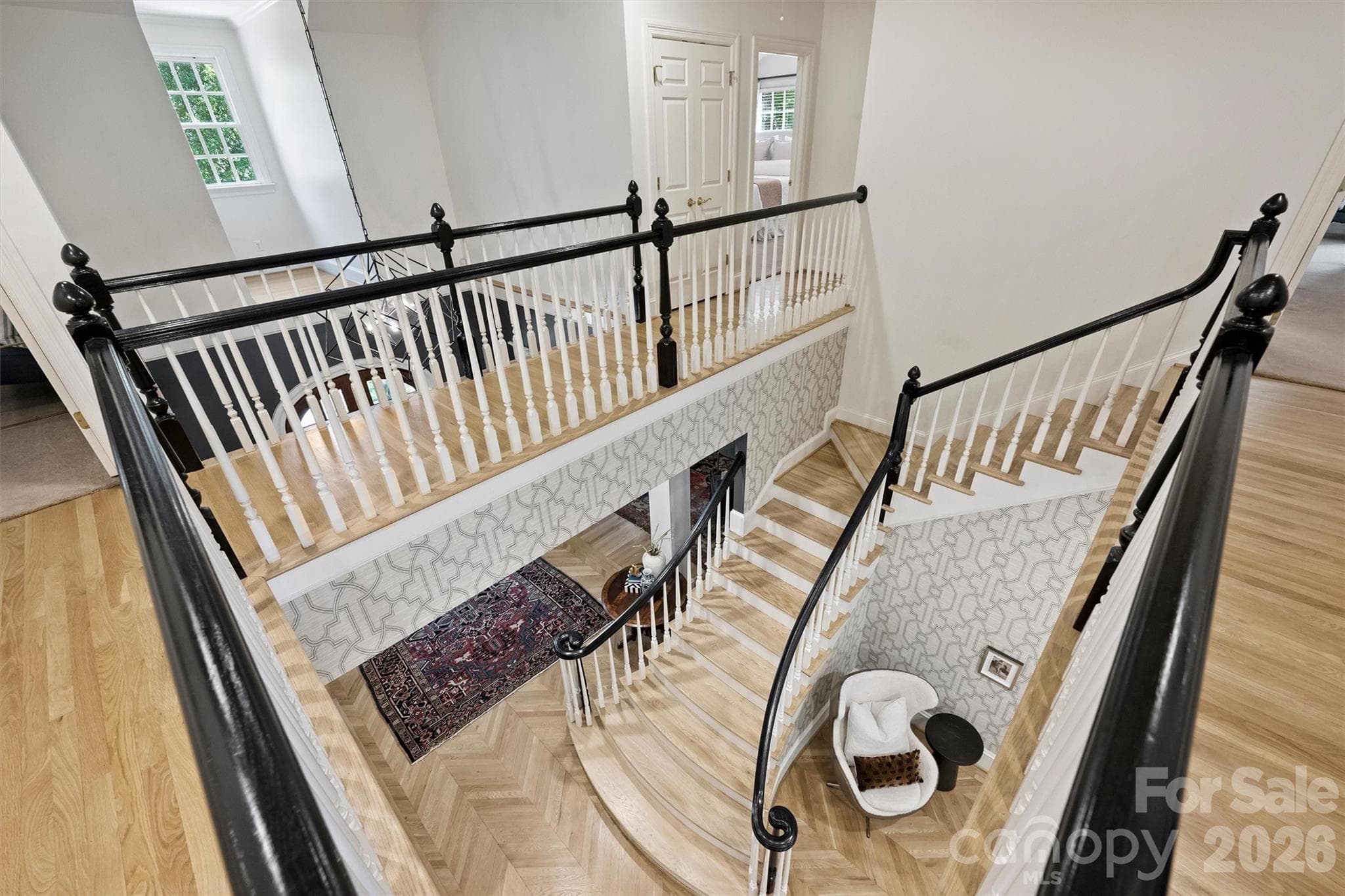 Beautiful staircase with flared stairs and curved banister. - 2115 Foxcroft Woods Lane, Charlotte