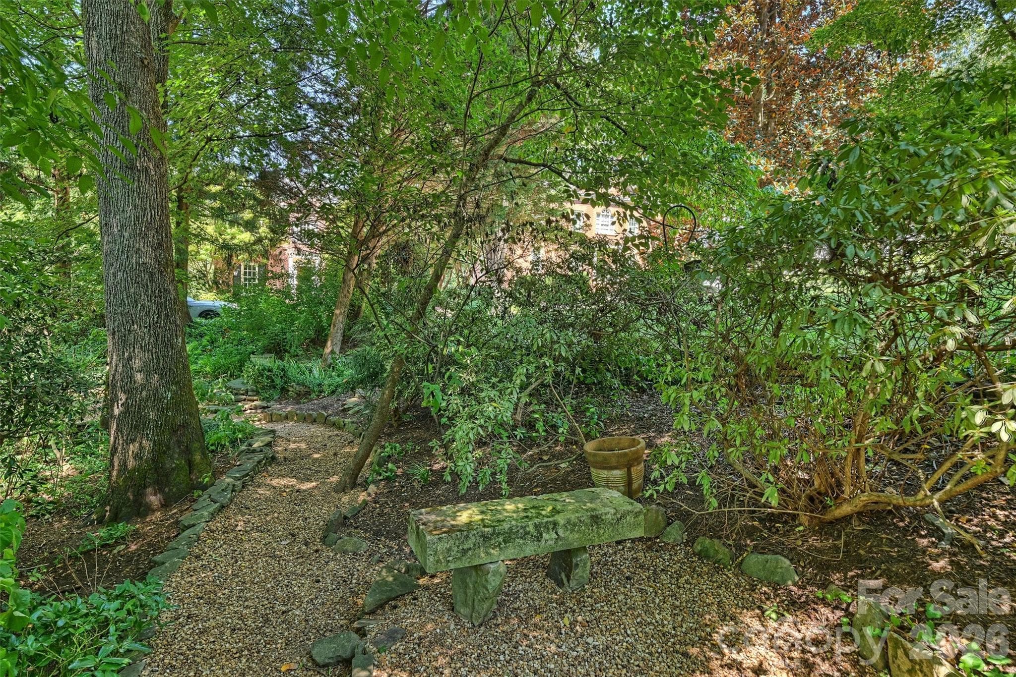 Benches, tables and chairs provide a multitude of options for entertaining or relaxing. - 2115 Foxcroft Woods Lane, Charlotte