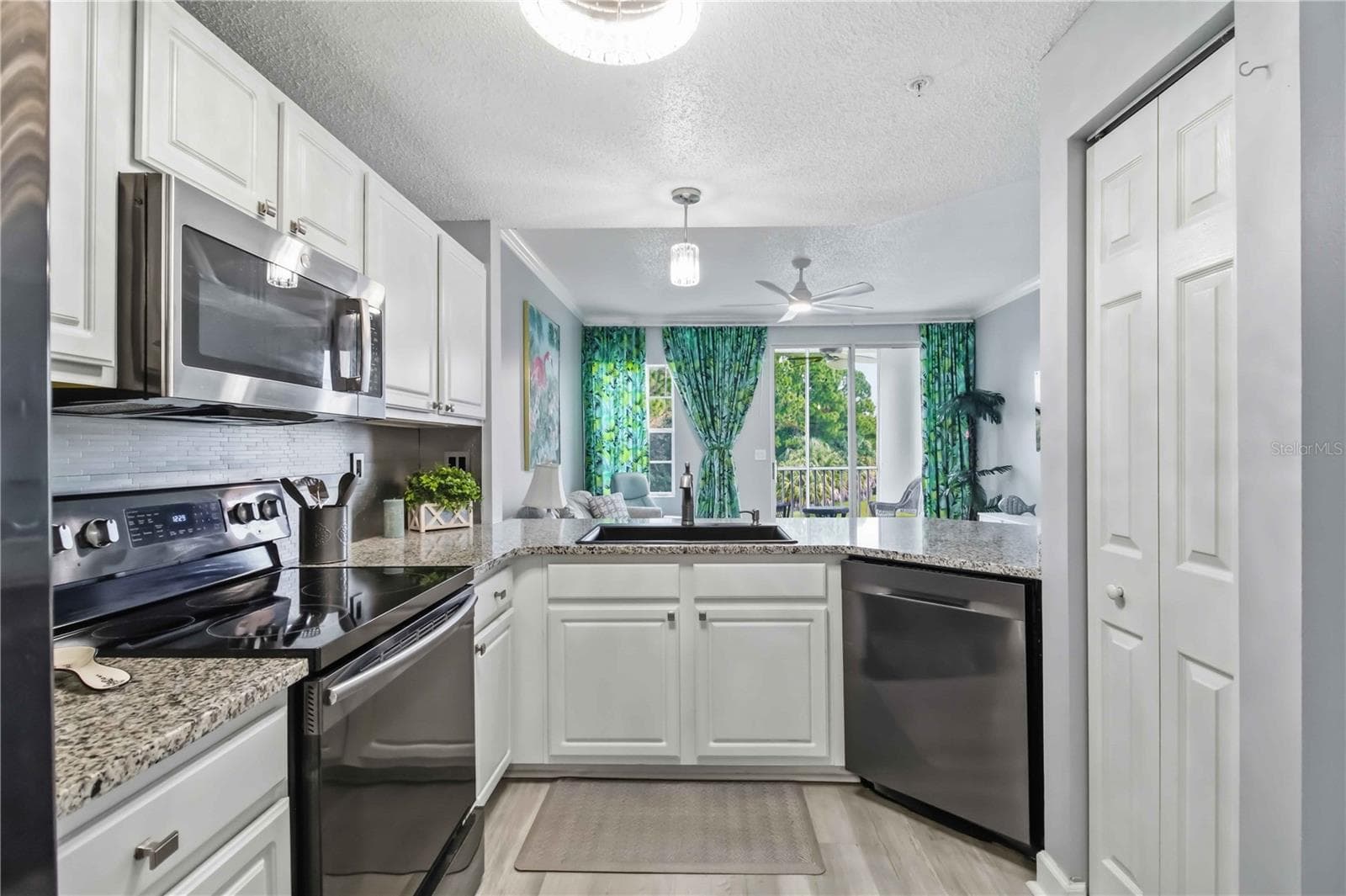 Updated Kitchen, Granite Counters, Abundant Cabinetry, Center Island - 5601 BENTGRASS DR #10-117, SARASOTA