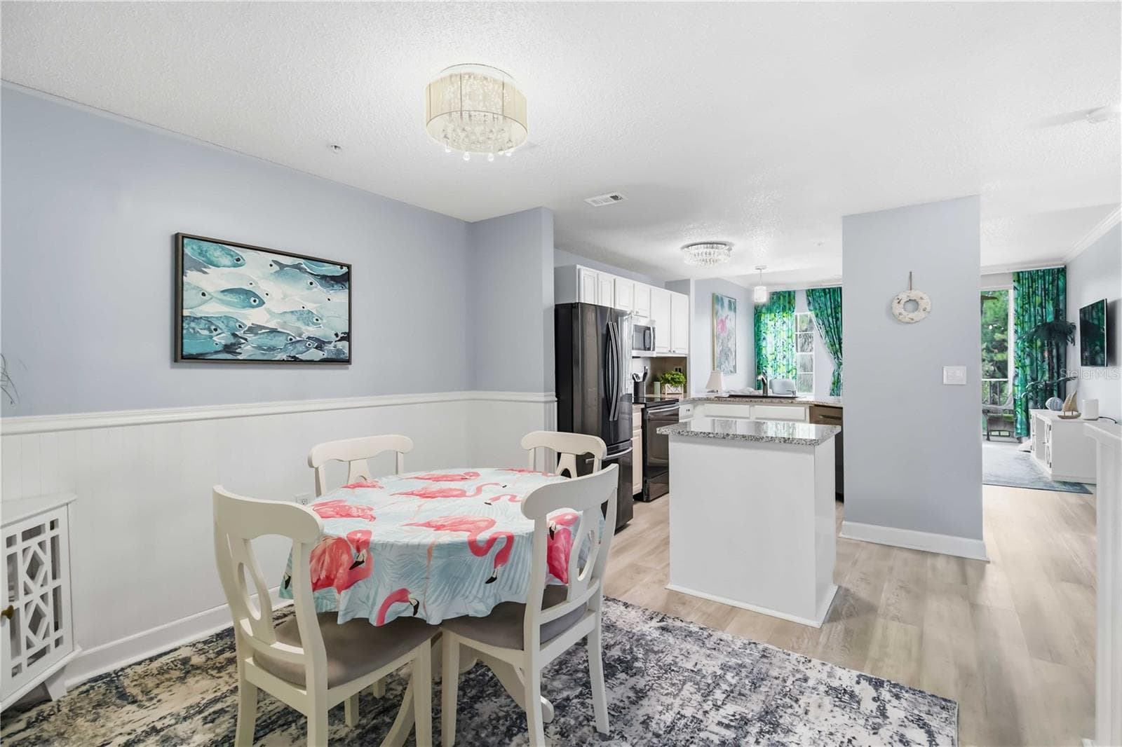 Dining Area with New Light Fixture - 5601 BENTGRASS DR #10-117, SARASOTA