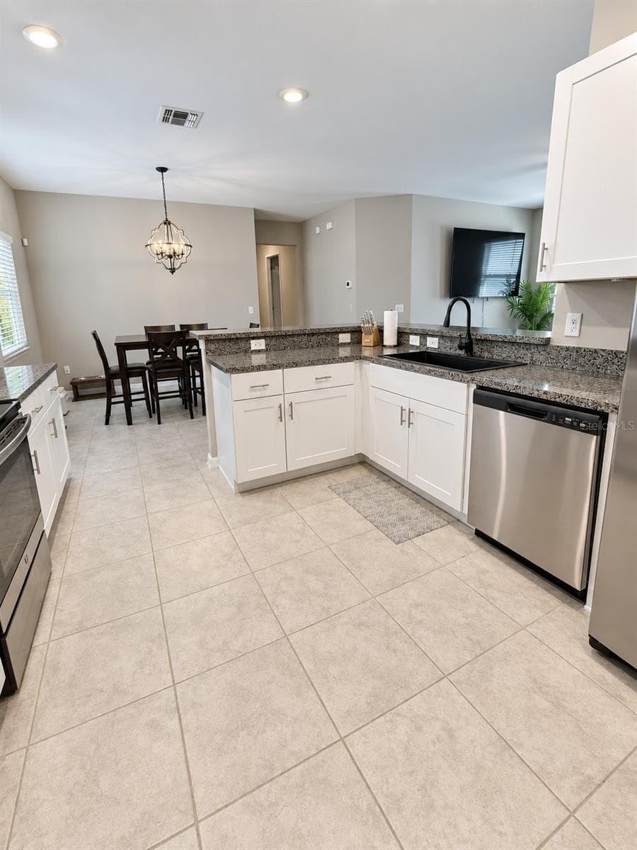 Kitchen looking from the laundry room - 9601 FLOURISH DR, LAND O LAKES
