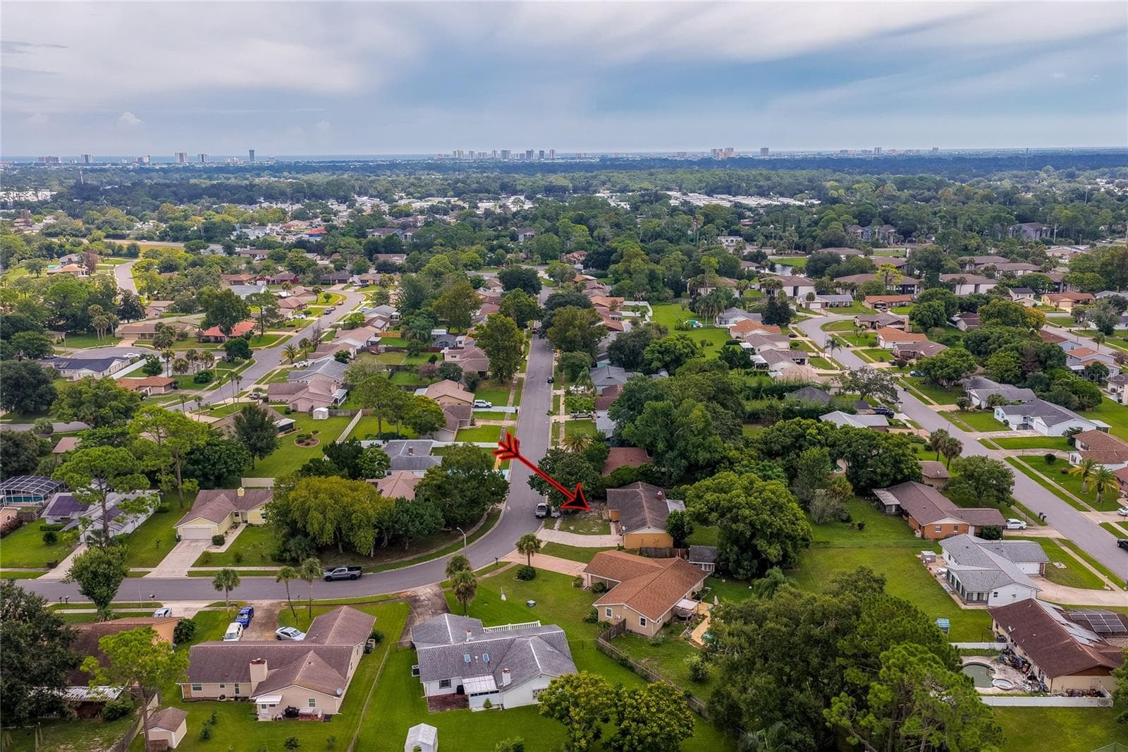 Distant aerial perspective showing the property position within the greater suburban neighborhood landscape. - 146 WESTWOOD DR, DAYTONA BEACH