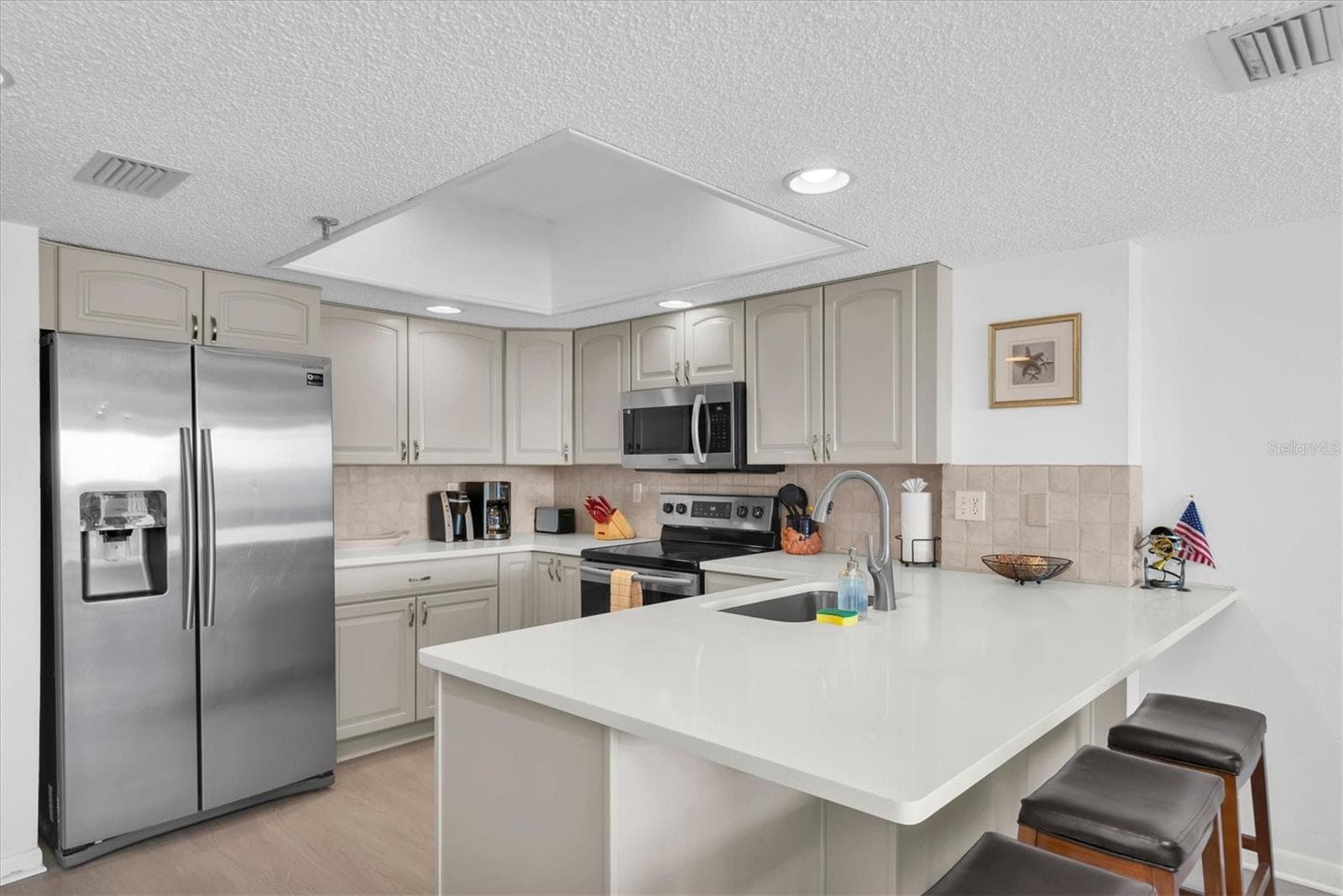 Bright clean kitchen with lots of cabinet and counter space - 14710 GULF BLVD #206, MADEIRA BEACH