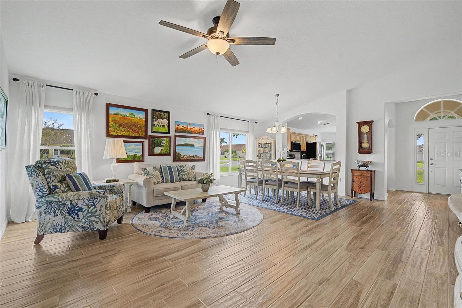 Bright and sunny great room with wood tile throughout - 12027 FERN TERRACE CT, TRINITY