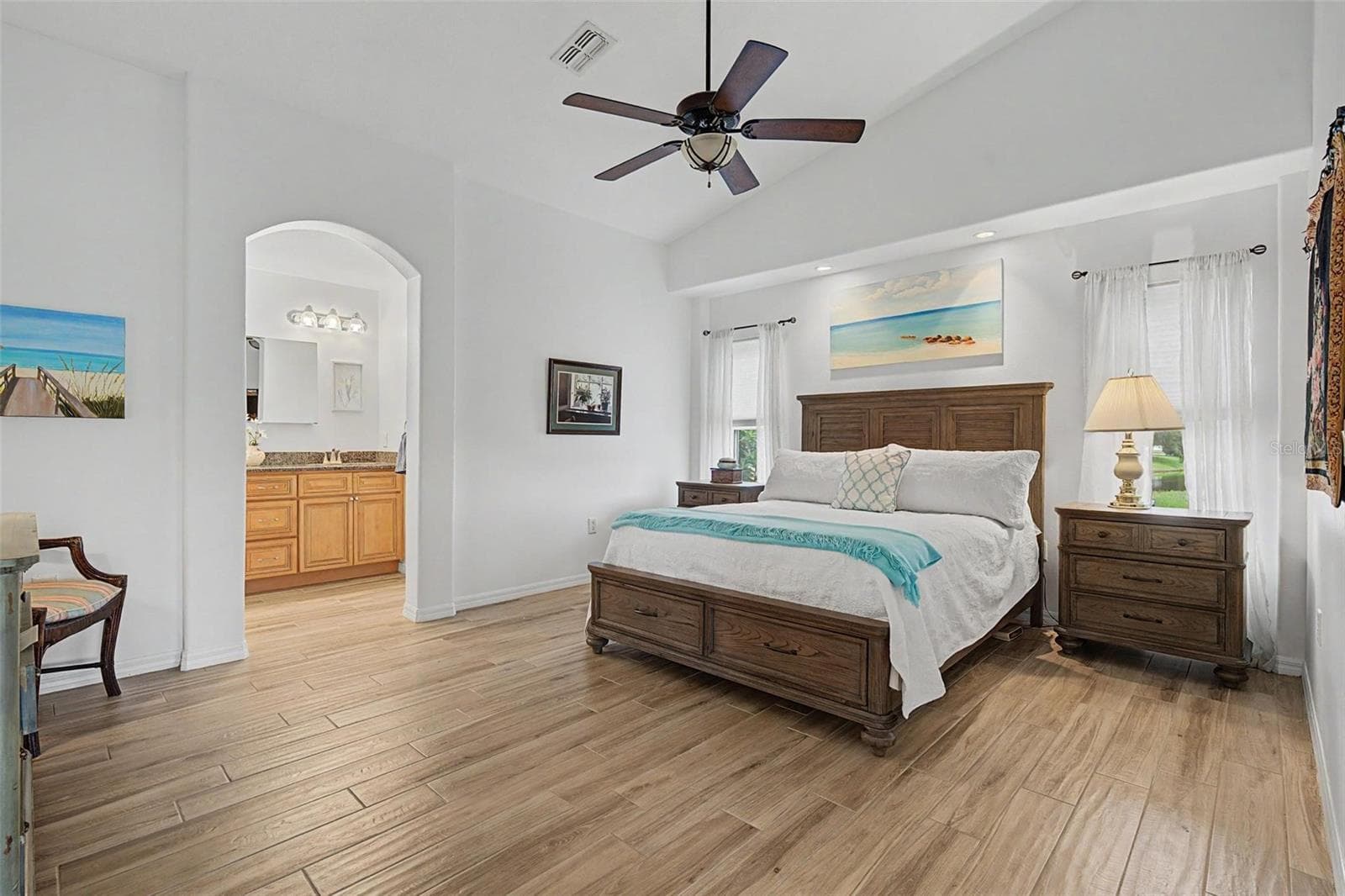 The vaulted ceiling and arched doorways in the master bedroom - 12027 FERN TERRACE CT, TRINITY