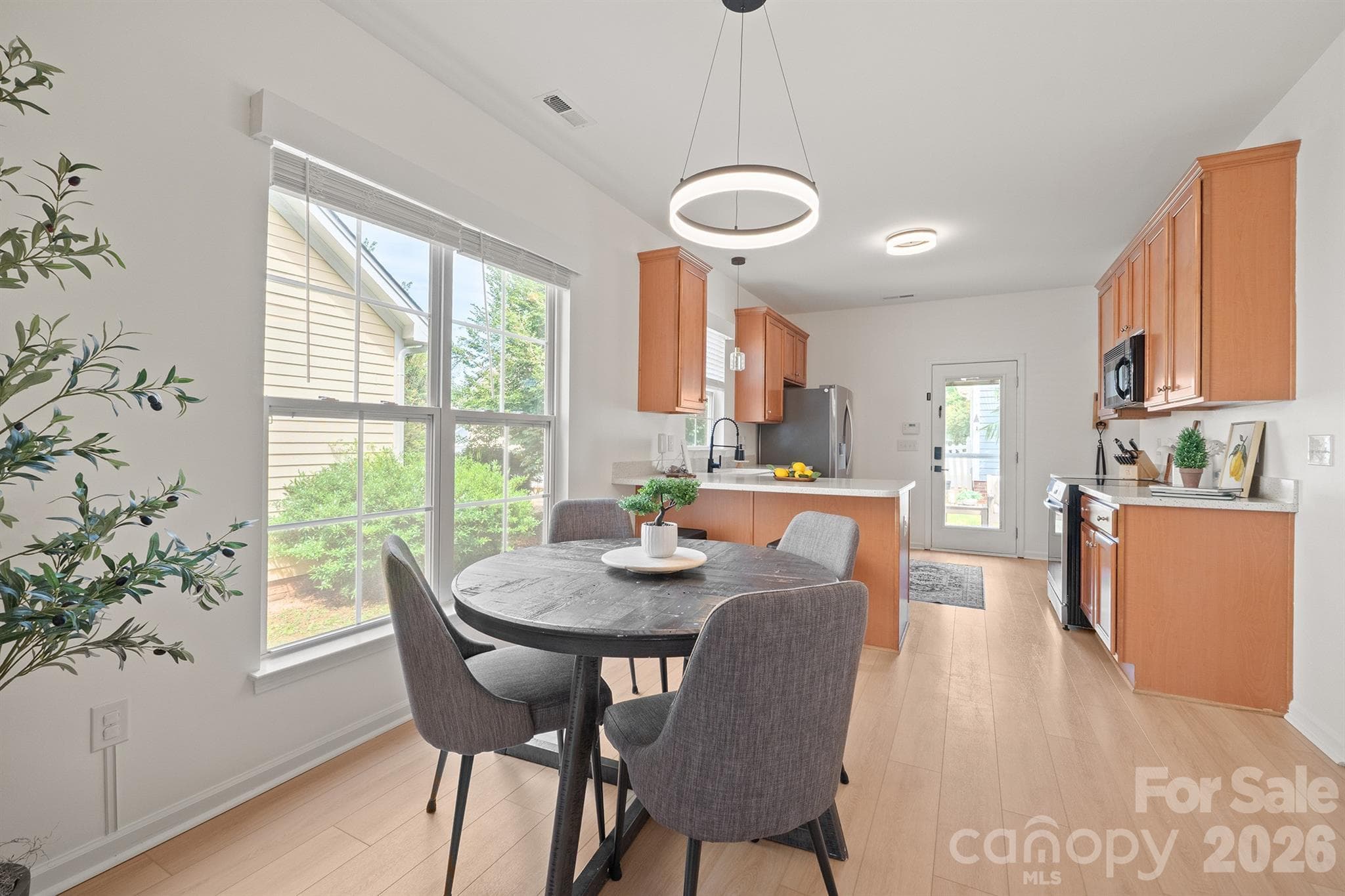 Dining and kitchen open to living room - 14525 Holly Springs Drive, Huntersville