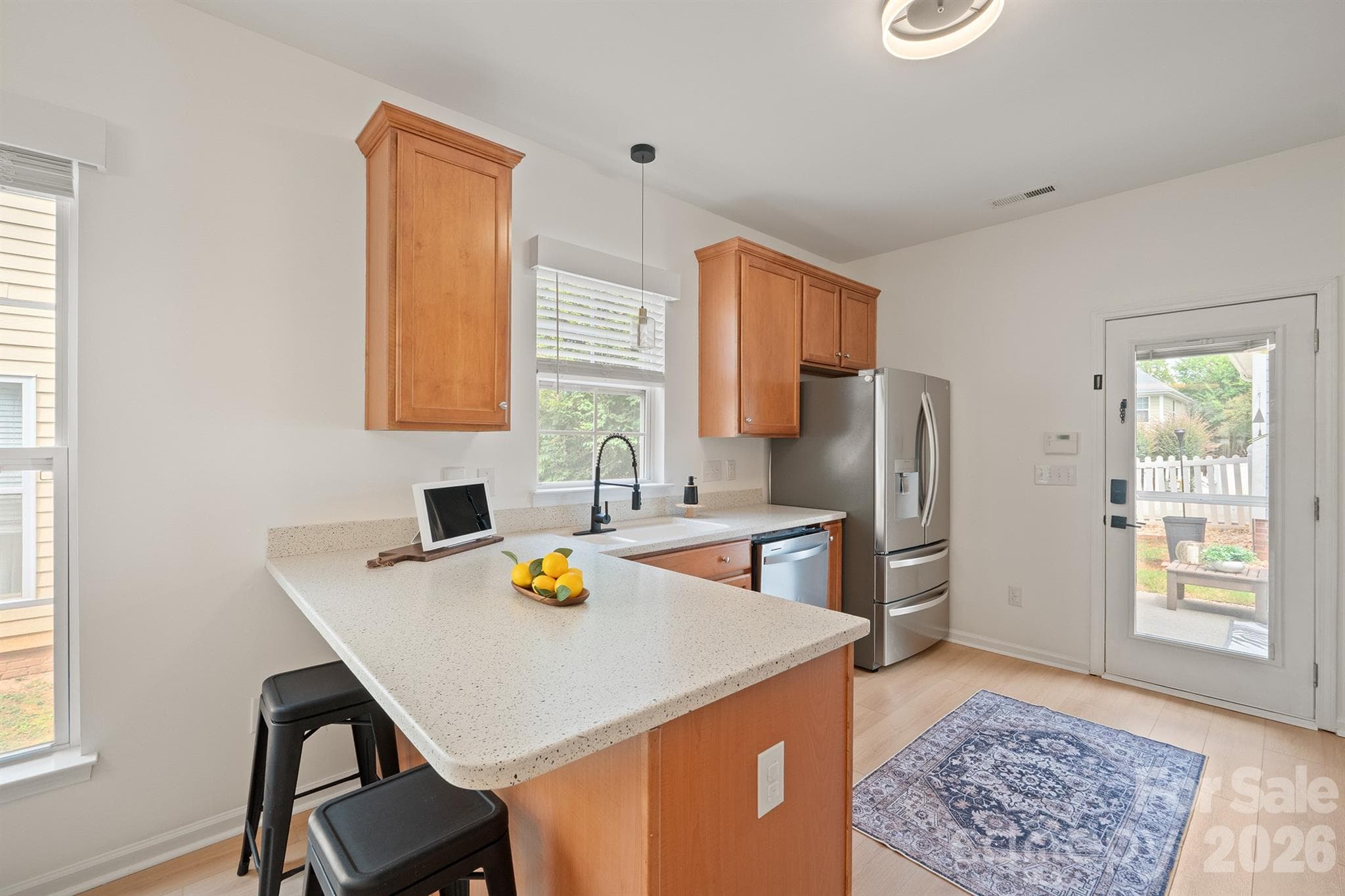 breakfast counter featuring corian countertops - 14525 Holly Springs Drive, Huntersville