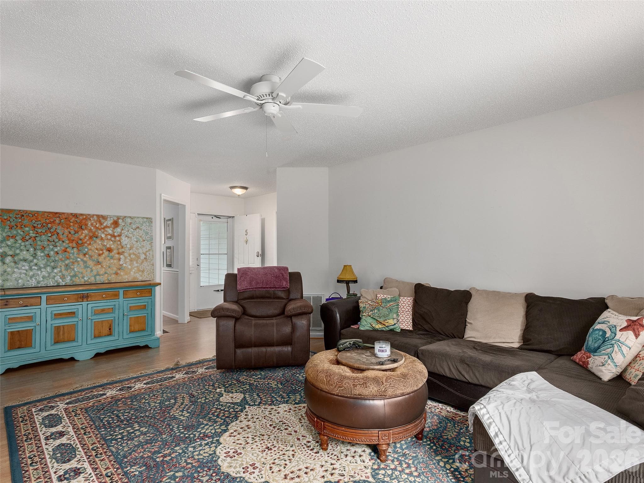 Bright living room offering generous space for relaxing and entertaining - 5 St Andrews Drive, Etowah