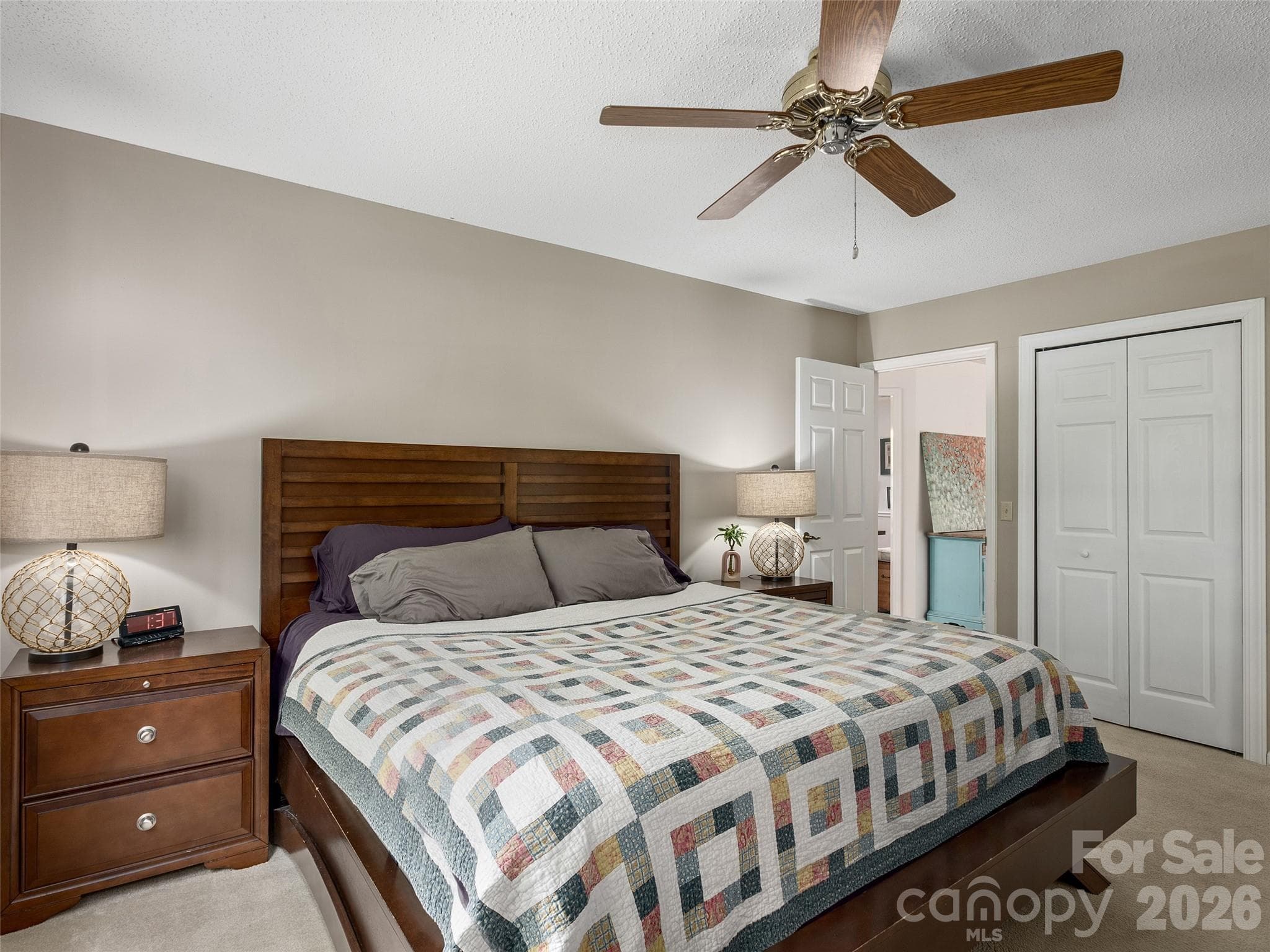Main-level primary bedroom provides comfortable single-level living in Etowahs Reach - 5 St Andrews Drive, Etowah