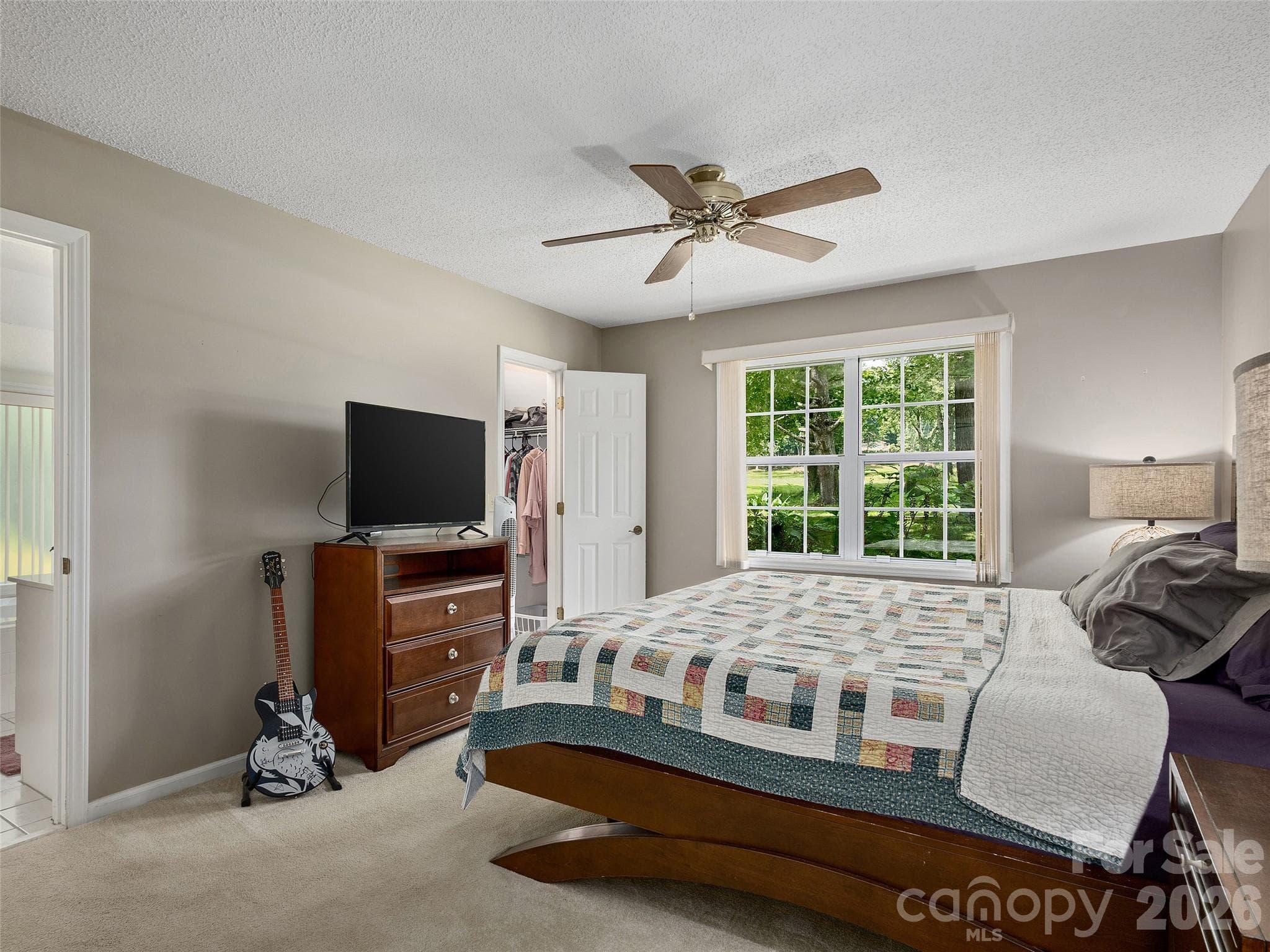 Spacious primary bedroom with abundant natural light and neutral finishes. - 5 St Andrews Drive, Etowah
