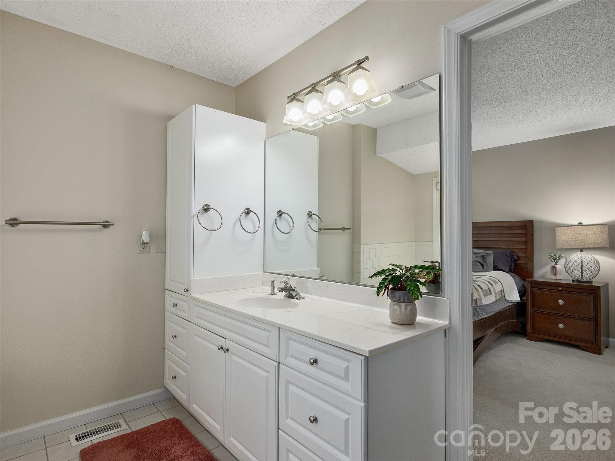 Primary bathroom features a large vanity with generous counter and storage space - 5 St Andrews Drive, Etowah