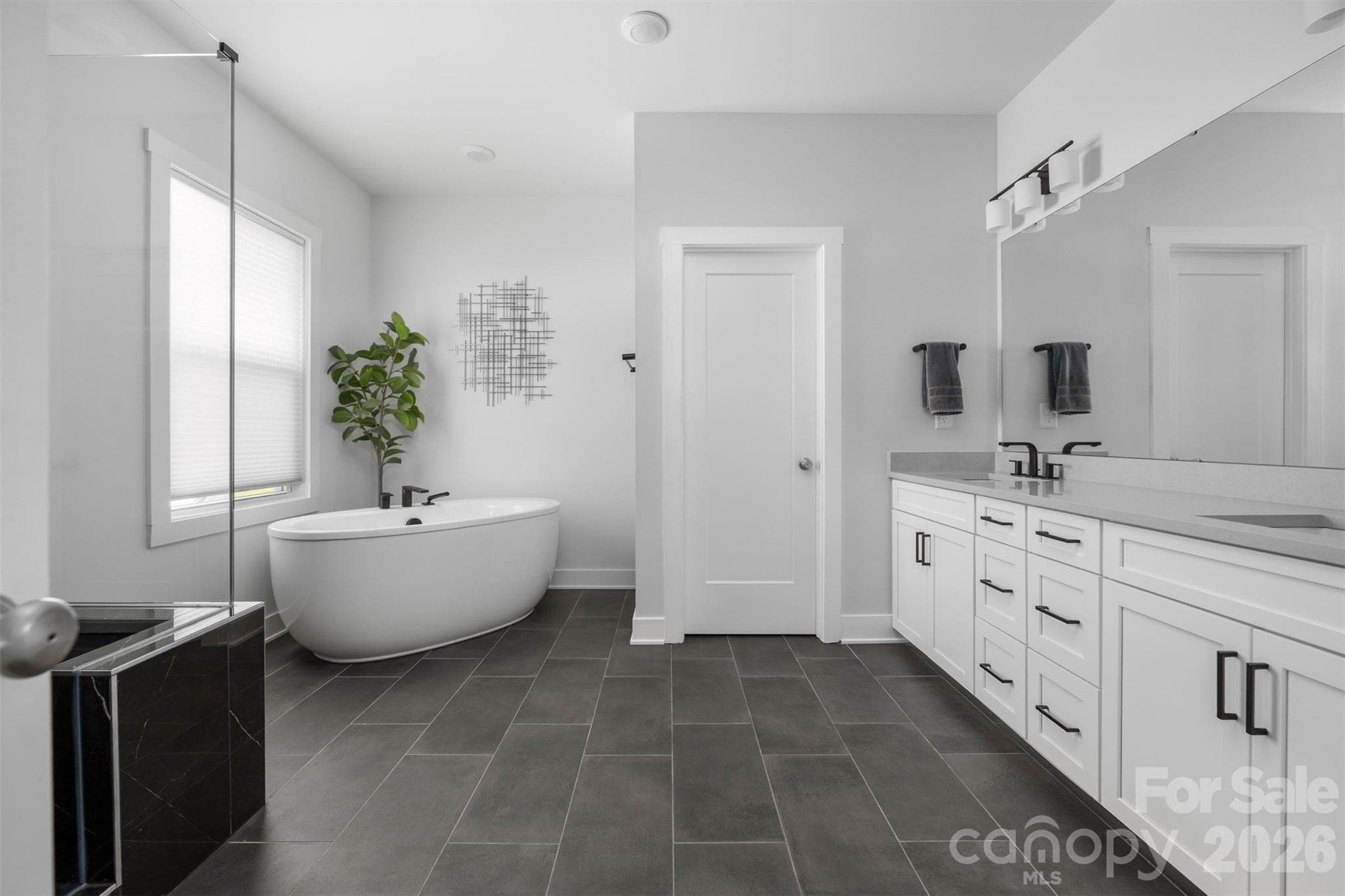 Primary bath with dual vanity, soaking tub, and walk-in shower - 4320 Tournette Drive, Indian Land