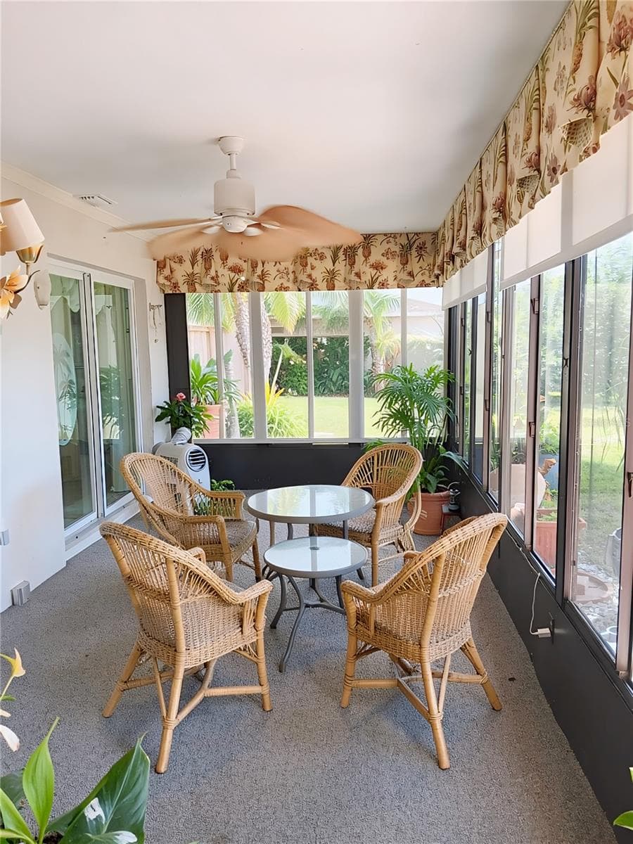 Lanai Staged looking out over the Lake / with Pull Down Sun Screens - 980 N GONDOLA DR, VENICE