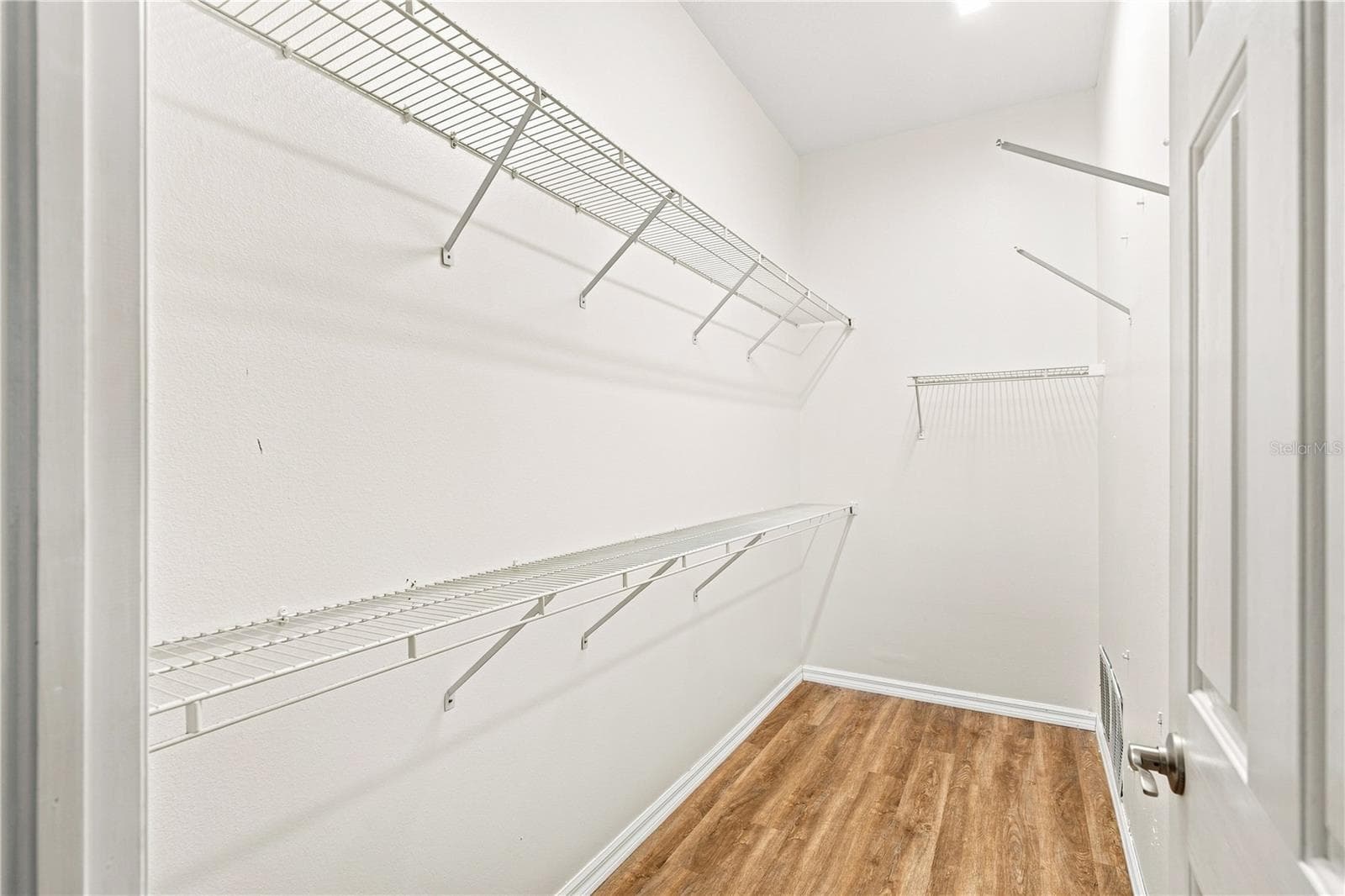 Primary Bedroom Walk-in Closet - 10097 HOLLY BERRY DR, WEEKI WACHEE