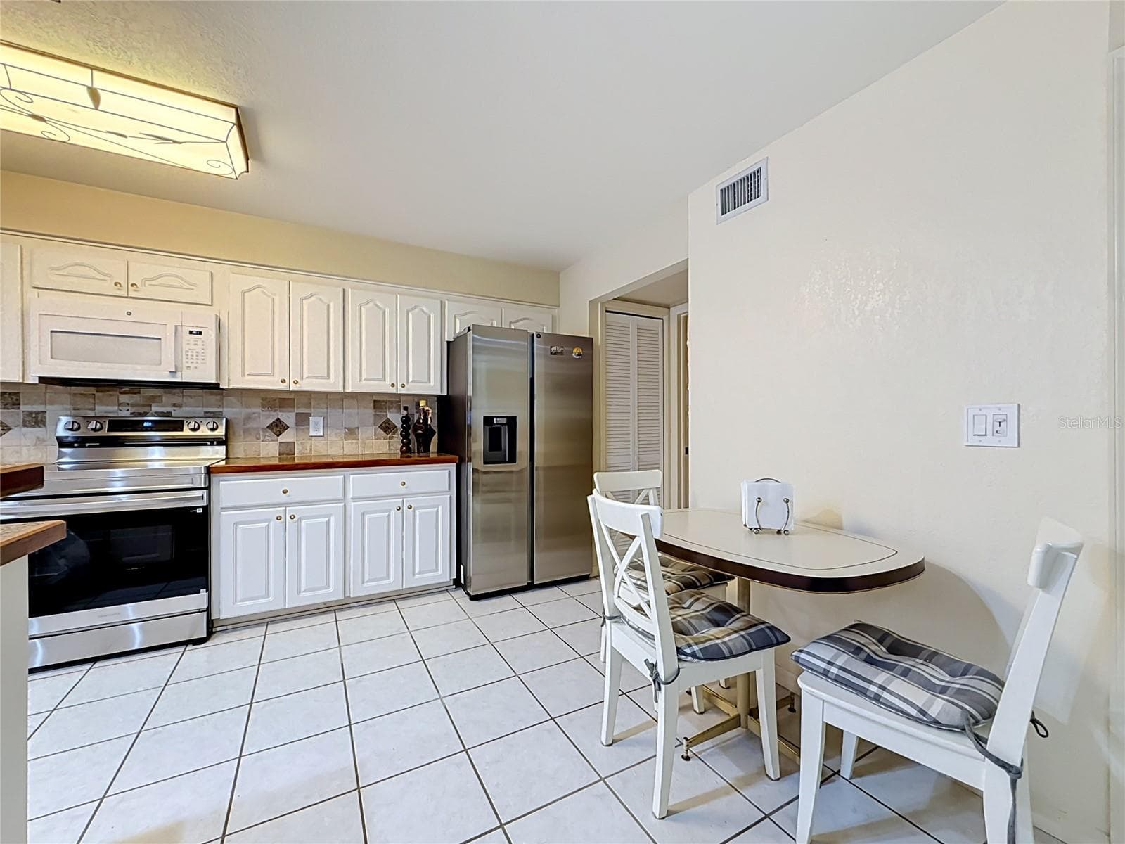 Brand new stainless steel fridge and range - 8830 DR MARTIN LUTHER KING JR ST N #UNIT 2B, ST PETERSBURG