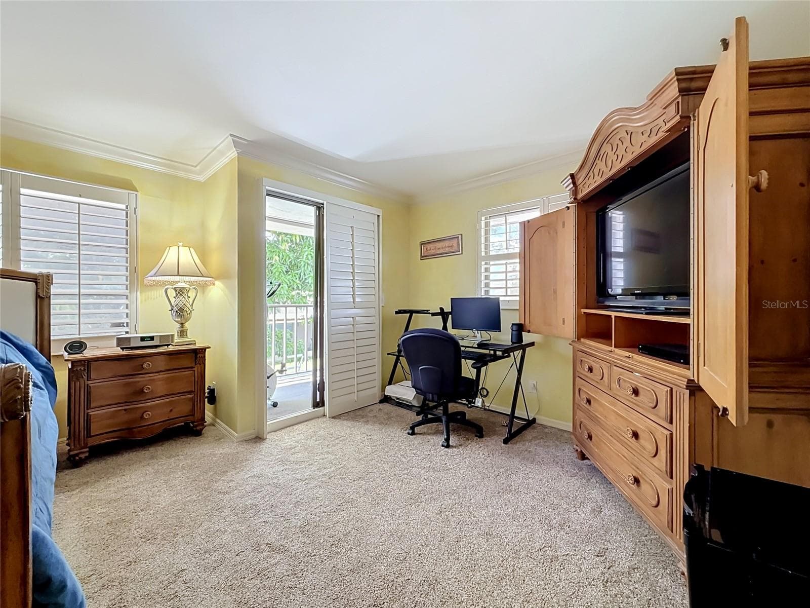 Master Bedroom with TV and computer desk - 8830 DR MARTIN LUTHER KING JR ST N #UNIT 2B, ST PETERSBURG