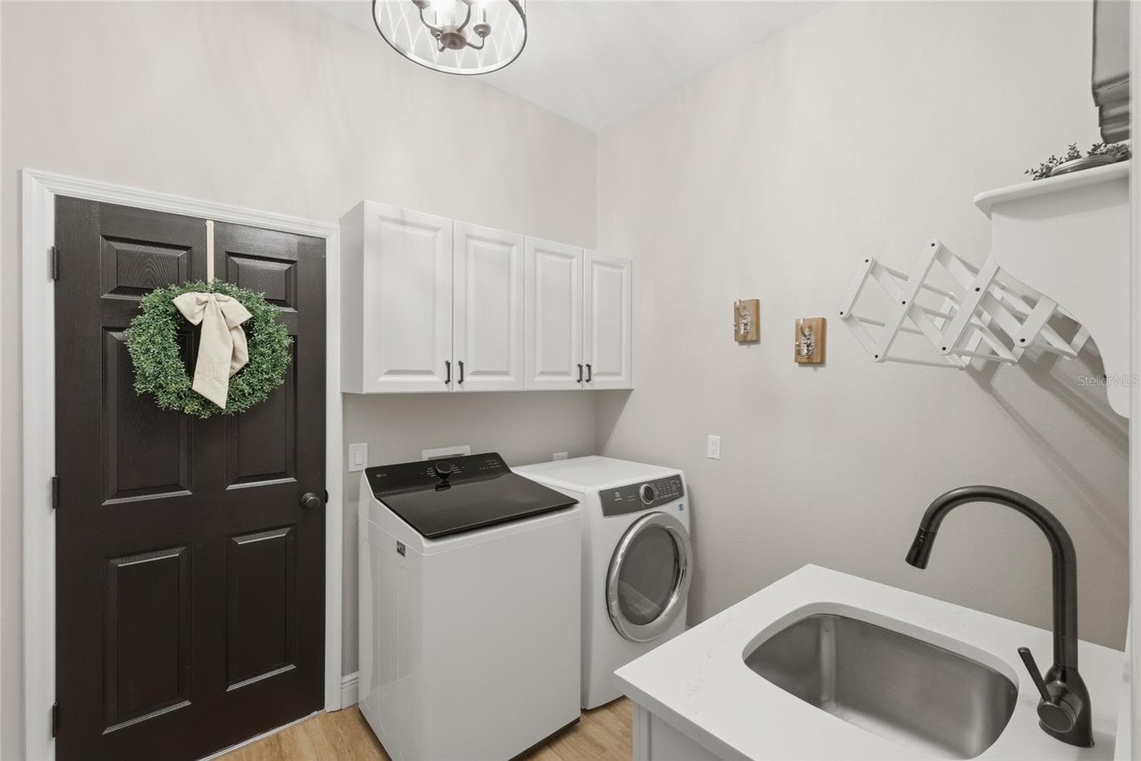 Laundry room is adjacent to primary suite. - 13994 SIENA LOOP, LAKEWOOD RANCH