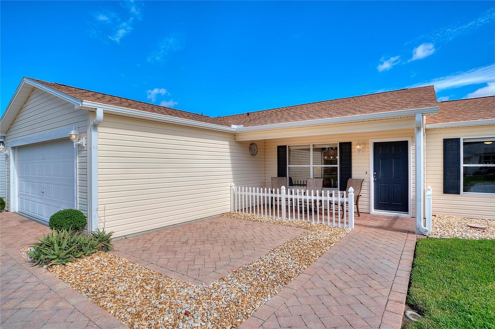 Covered front porch offers a comfortable spot for morning coffee and conversations with neighbors. - 2713 DE LA ROSA ST, THE VILLAGES