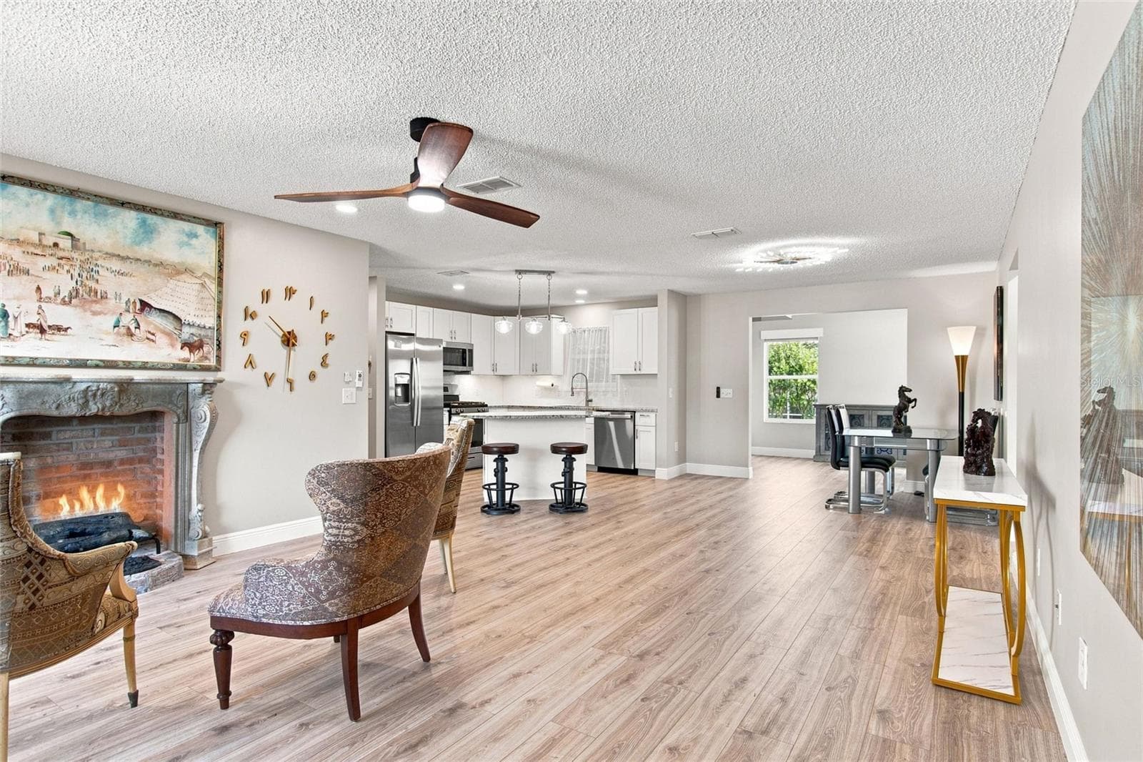 Open living, dining and kitchen spaces make it easy to gather with friends. - 2713 DE LA ROSA ST, THE VILLAGES