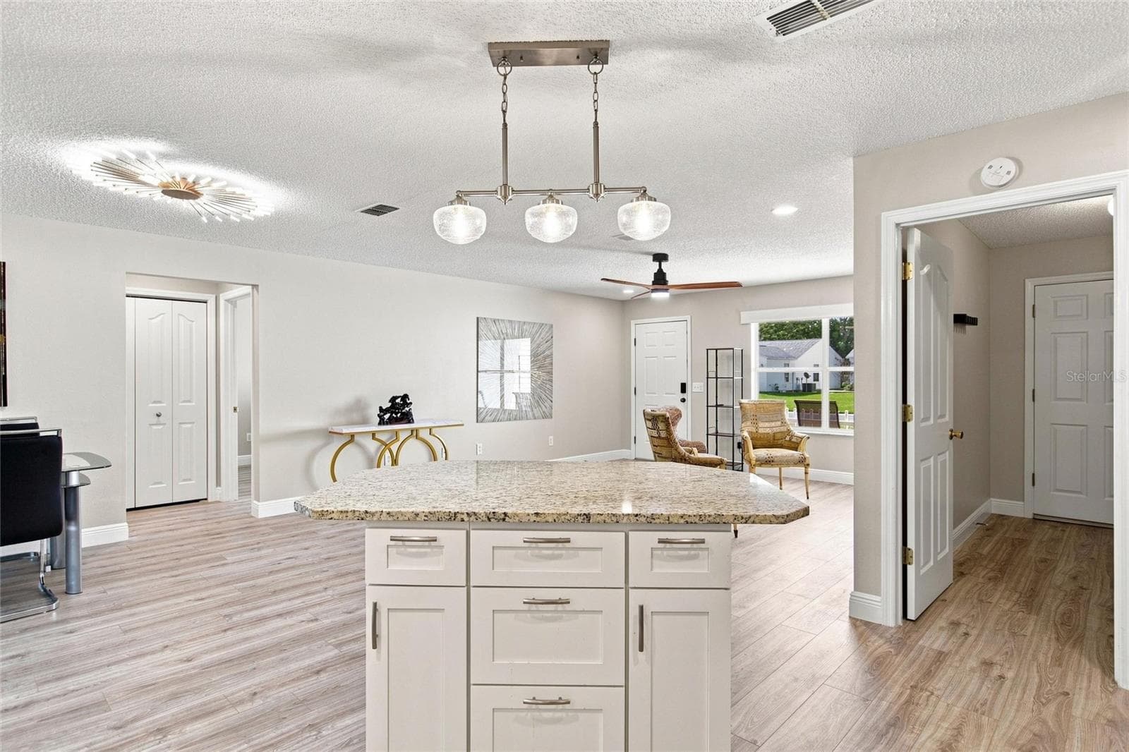 Kitchen island provides breakfast seating, extra workspace and convenient drawer storage. - 2713 DE LA ROSA ST, THE VILLAGES