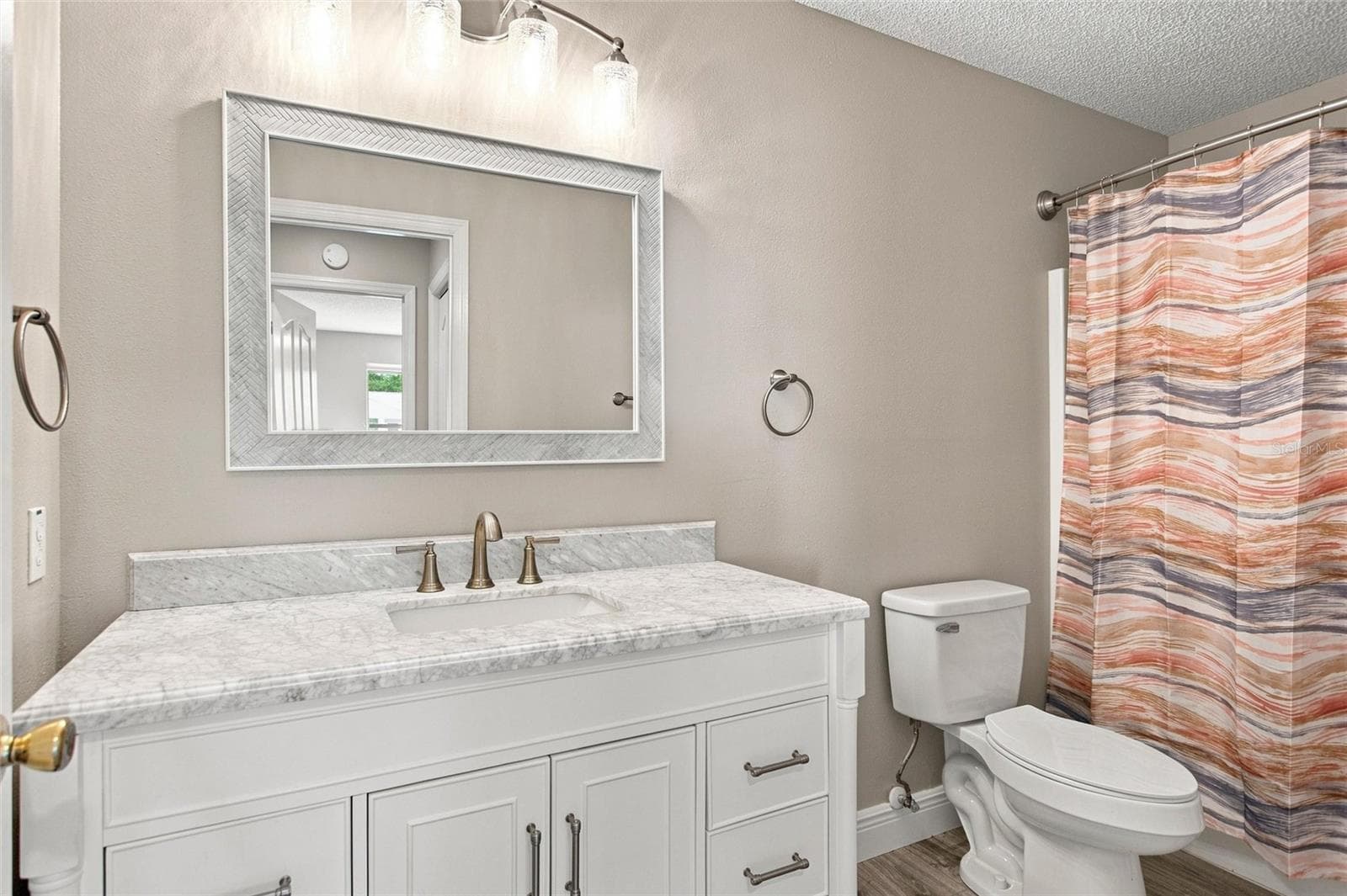 Guest bathroom features a spacious vanity and a tub/shower combination. - 2713 DE LA ROSA ST, THE VILLAGES