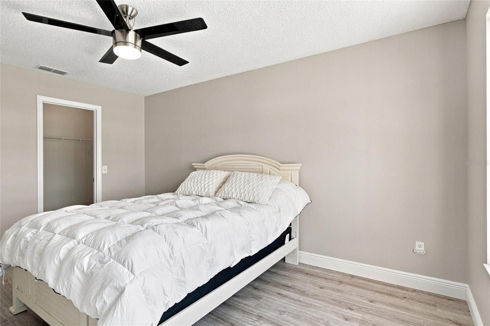 Guest bedroom includes a walk-in closet for convenient storage. - 2713 DE LA ROSA ST, THE VILLAGES