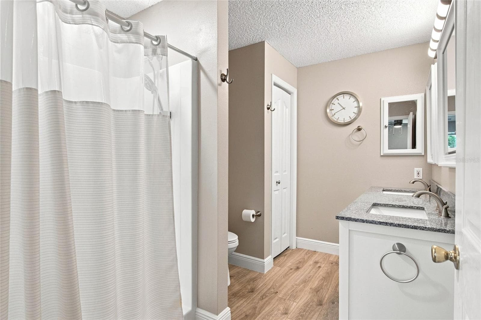 Primary bathroom features a shower and a separate toilet area. - 2713 DE LA ROSA ST, THE VILLAGES