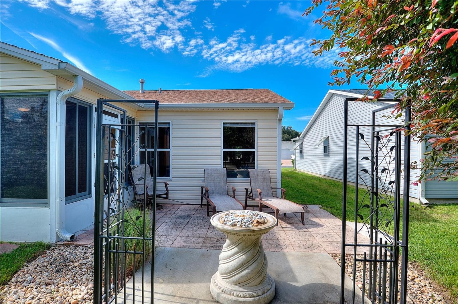 Outdoor patio just off the lanai offers a spot to enjoy the sunshine or gather with friends. - 2713 DE LA ROSA ST, THE VILLAGES