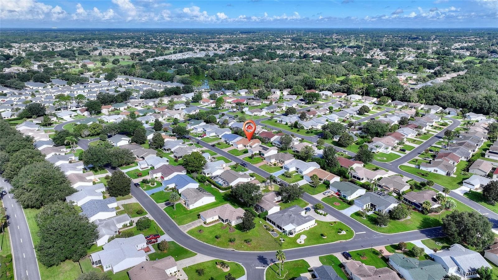 Aerial perspective of the neighborhood's winding streets and established landscaping. - 2713 DE LA ROSA ST, THE VILLAGES