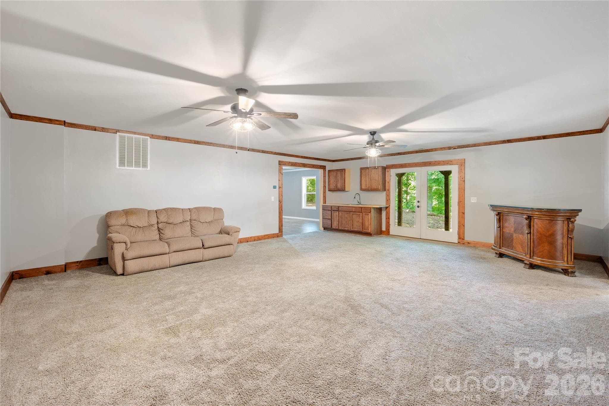 Lower Level Family Room with Sink, Cabinetry and Exterior Access - 72 Summer Shade Court, Hendersonville