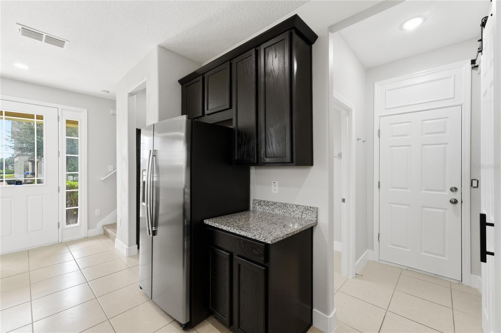 Additional kitchen cabinetry and counter space provide convenient storage and the perfect coffee-bar station. - 2615 GIARDINO LOOP, KISSIMMEE