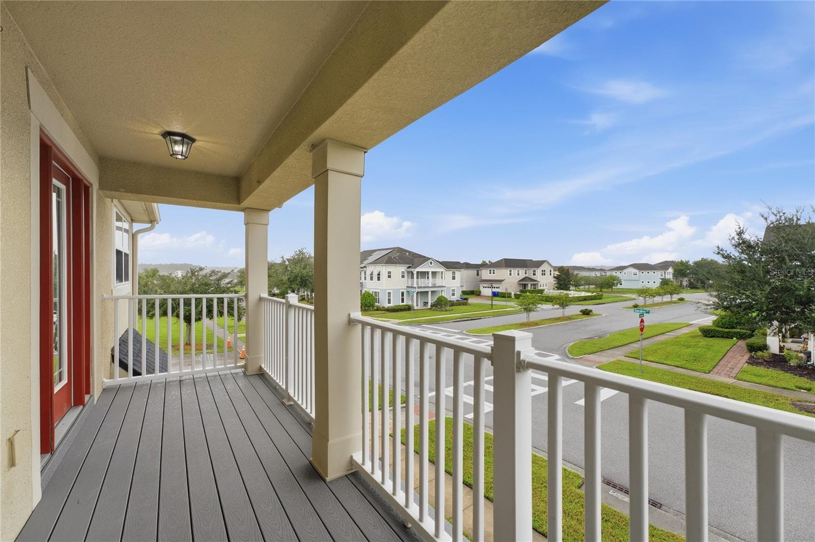 Spacious covered second-floor balcony—perfect for relaxing and enjoying the evening skies. - 2615 GIARDINO LOOP, KISSIMMEE