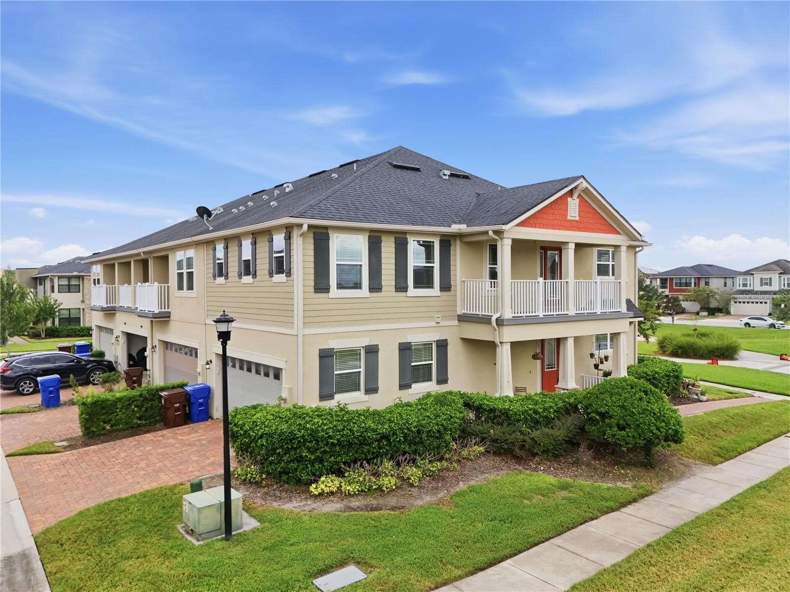 End-unit townhome occupying the entire end of the building, with additional windows, a two-car garage and private balcony. - 2615 GIARDINO LOOP, KISSIMMEE