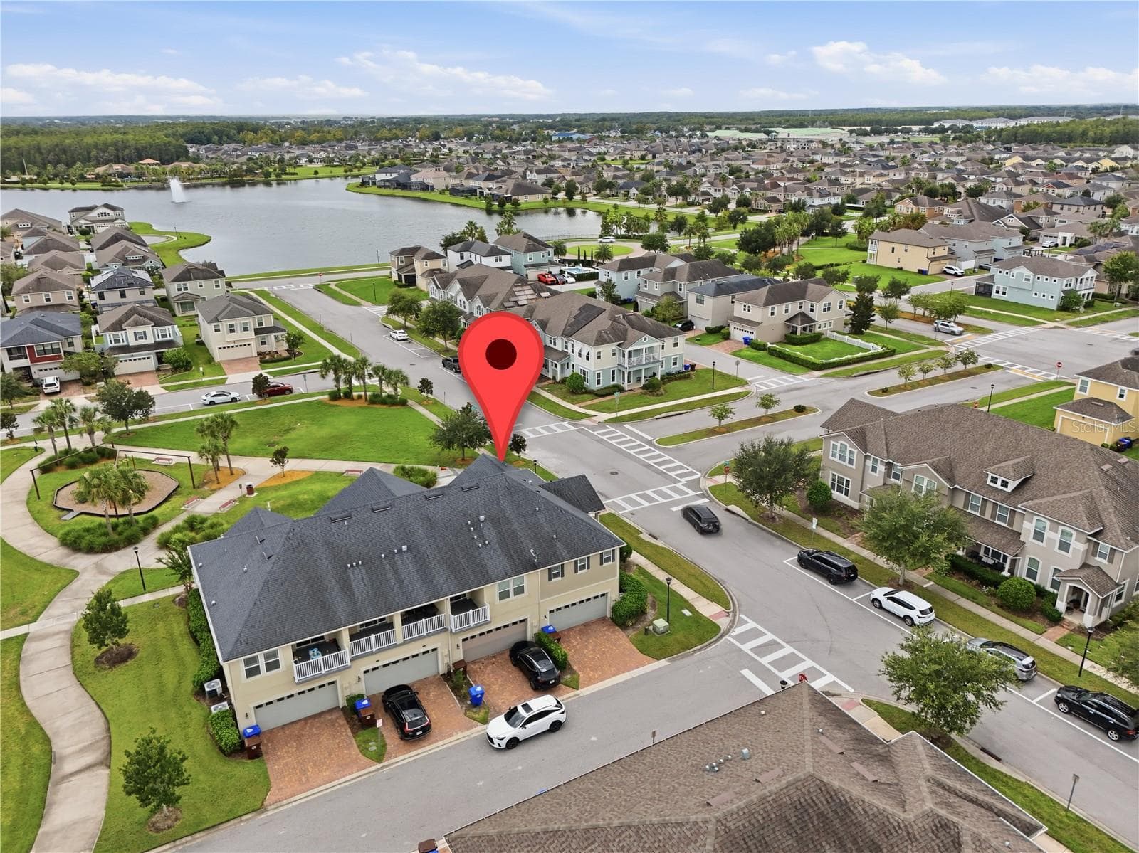 Aerial view highlighting the home’s prime location beside the park and near the community lake. - 2615 GIARDINO LOOP, KISSIMMEE