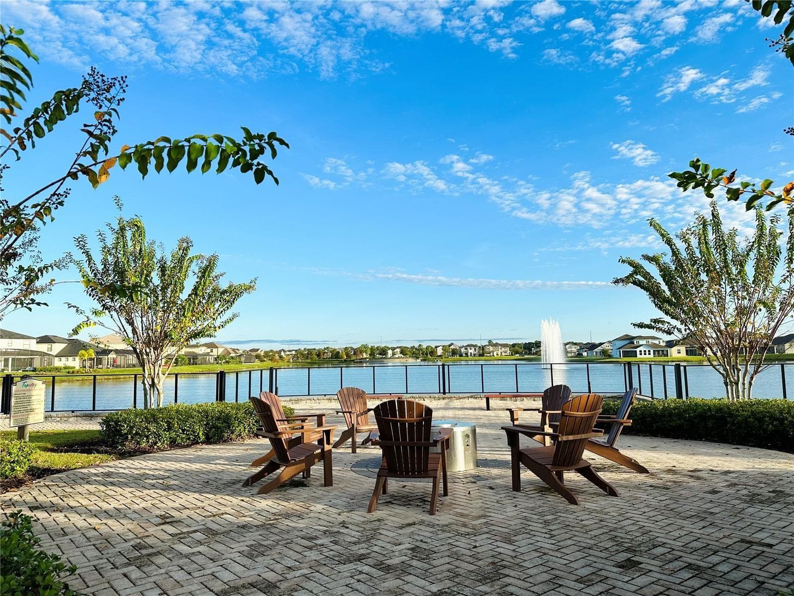 Lakefront community fire-pit lounge with peaceful fountain views. - 2615 GIARDINO LOOP, KISSIMMEE