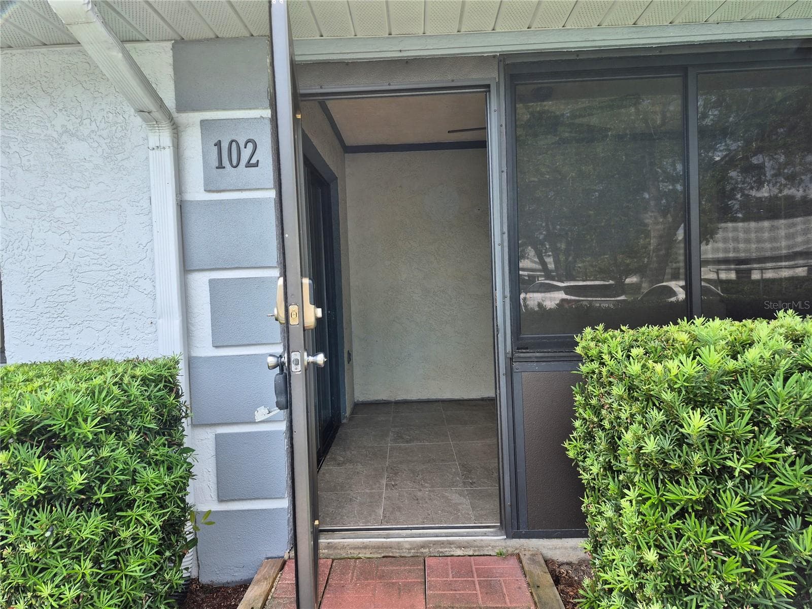 Patio Entrance - 2721 COUNTRYSIDE BLVD #102, CLEARWATER