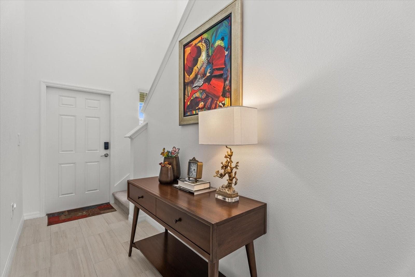 Welcoming foyer with tile flooring and a bright, neutral interior. - 8431 BELLA MAR TRL, PARRISH
