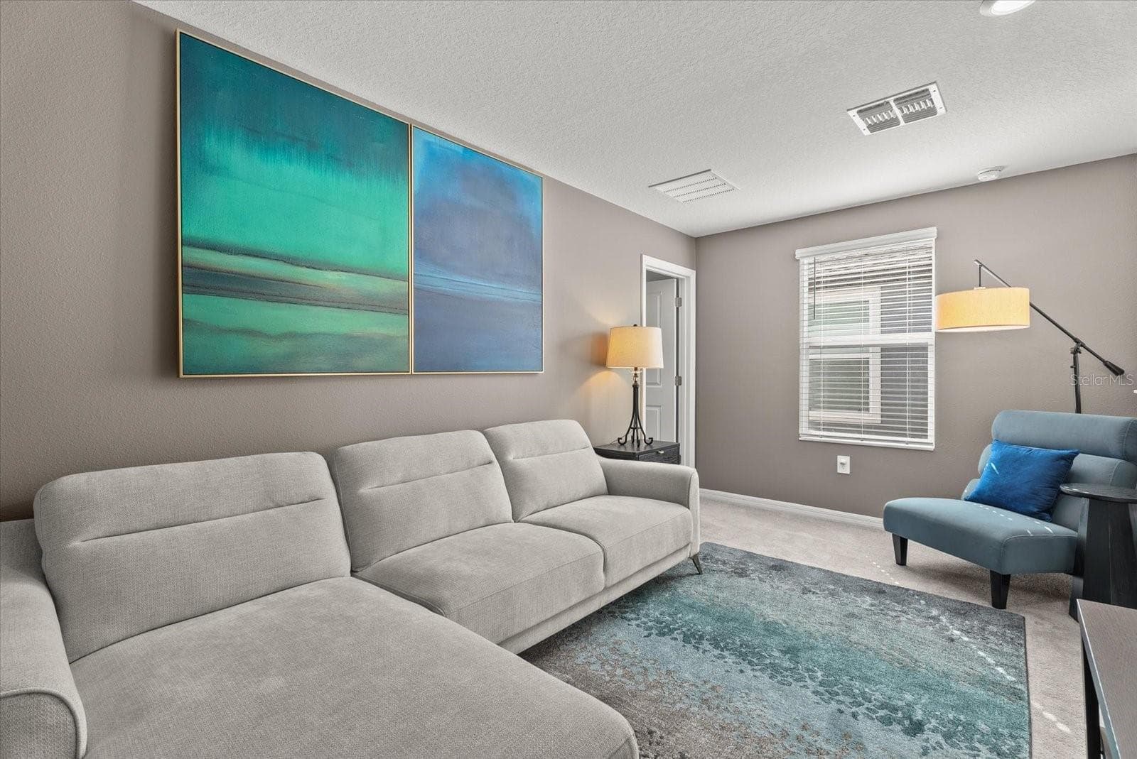 Versatile upstairs loft, ideal for a media room, office, or additional lounge. - 8431 BELLA MAR TRL, PARRISH