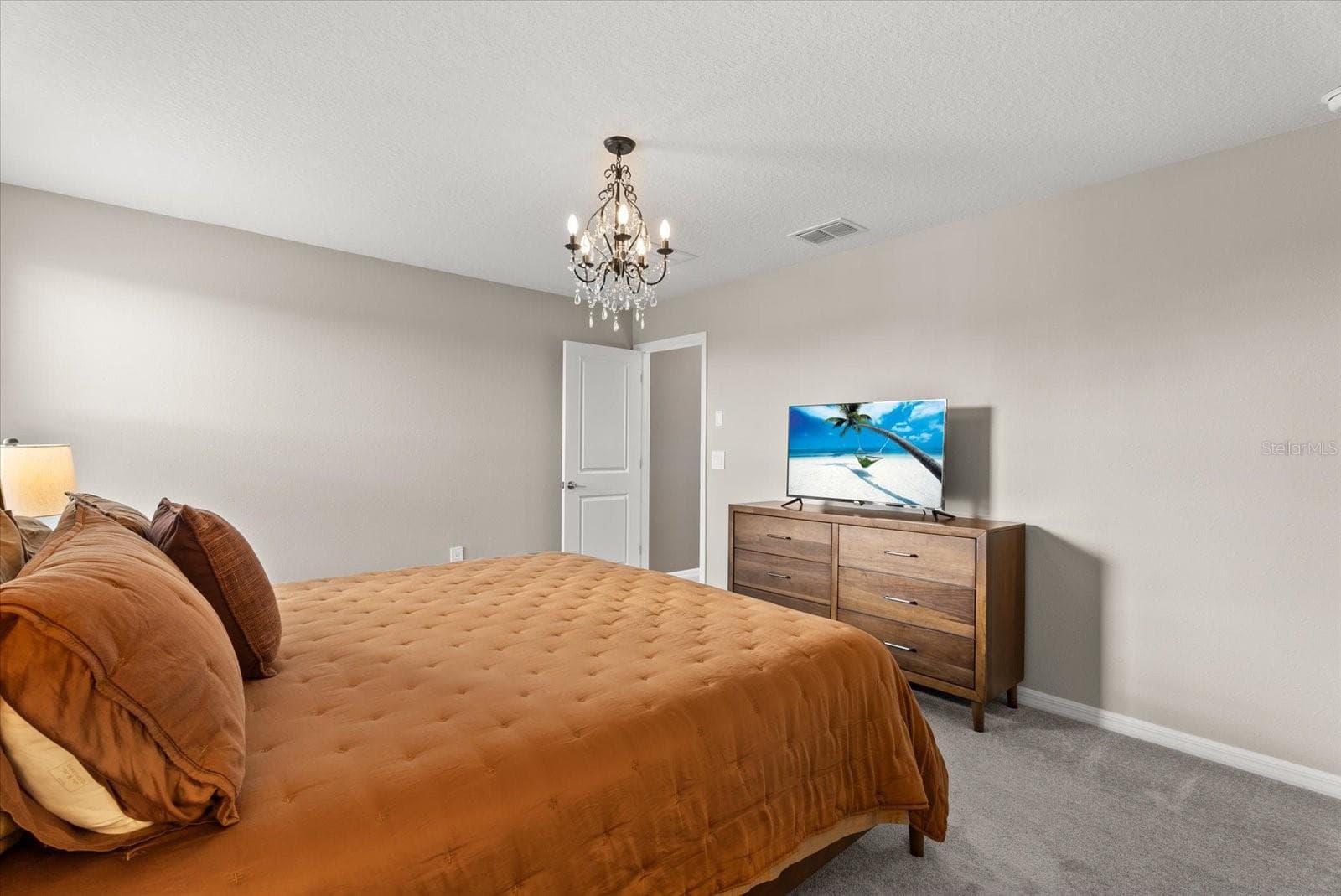 Another view of the spacious primary suite with neutral finishes. - 8431 BELLA MAR TRL, PARRISH