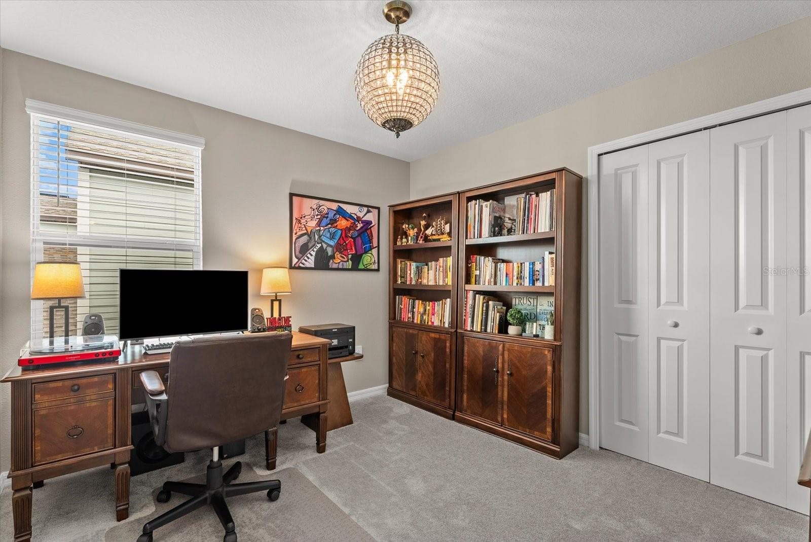 Secondary bedroom currently arranged as a comfortable home office. - 8431 BELLA MAR TRL, PARRISH