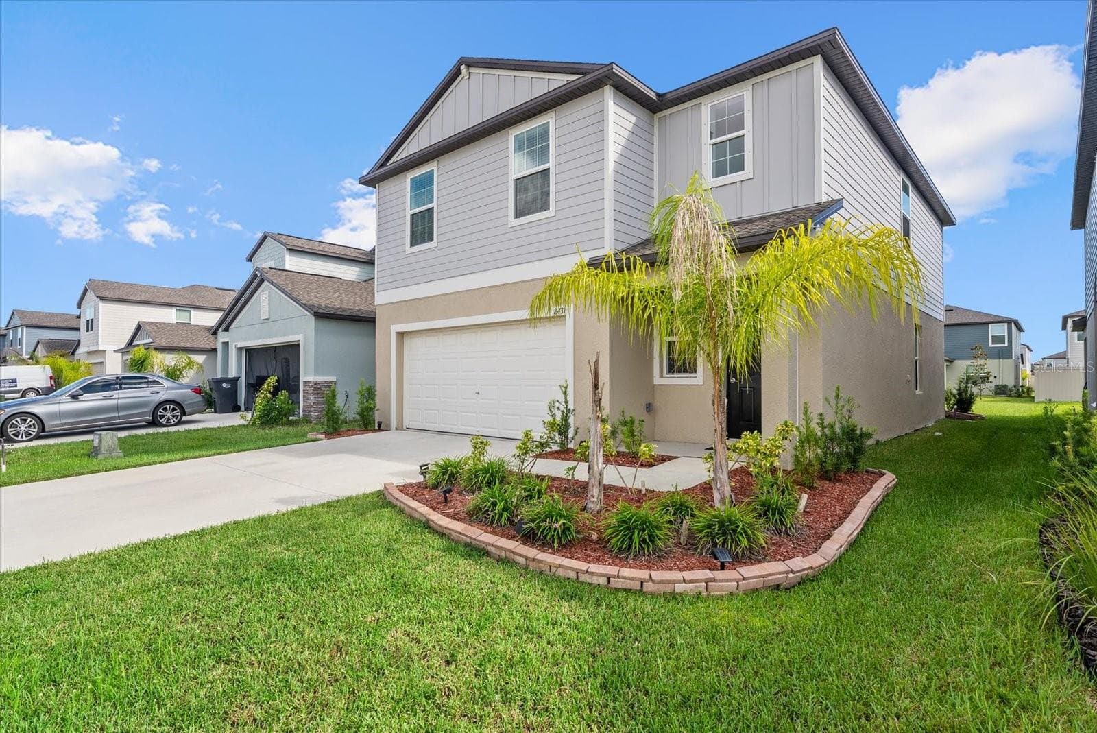 Attractive two-story exterior with an attached two-car garage. - 8431 BELLA MAR TRL, PARRISH