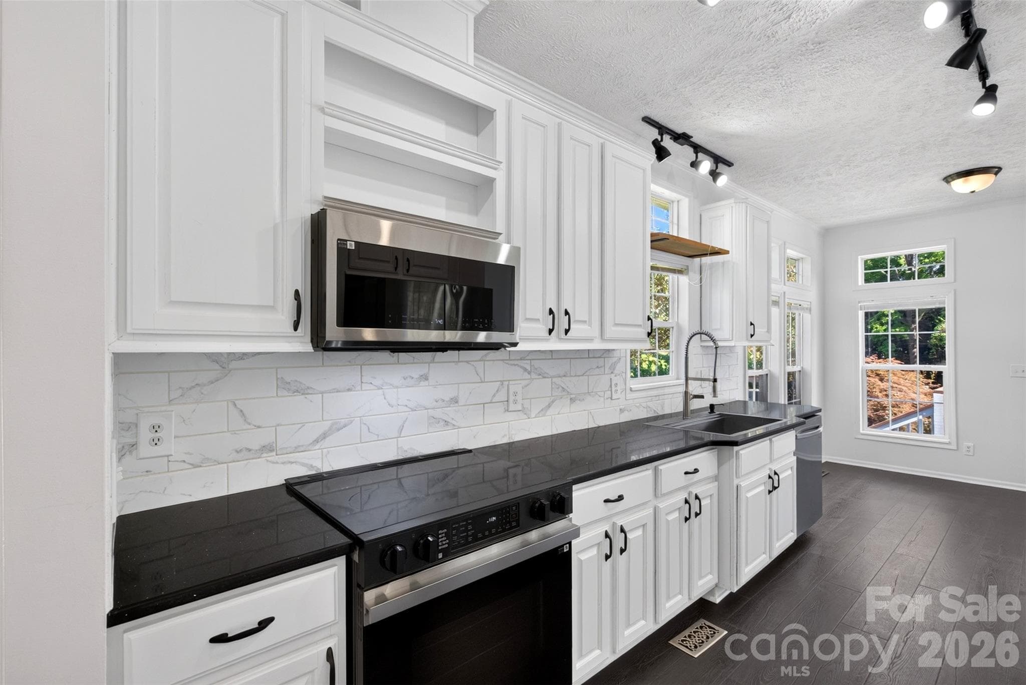 modern kitchen with newer appliances - 6 Enochs Way, Fletcher
