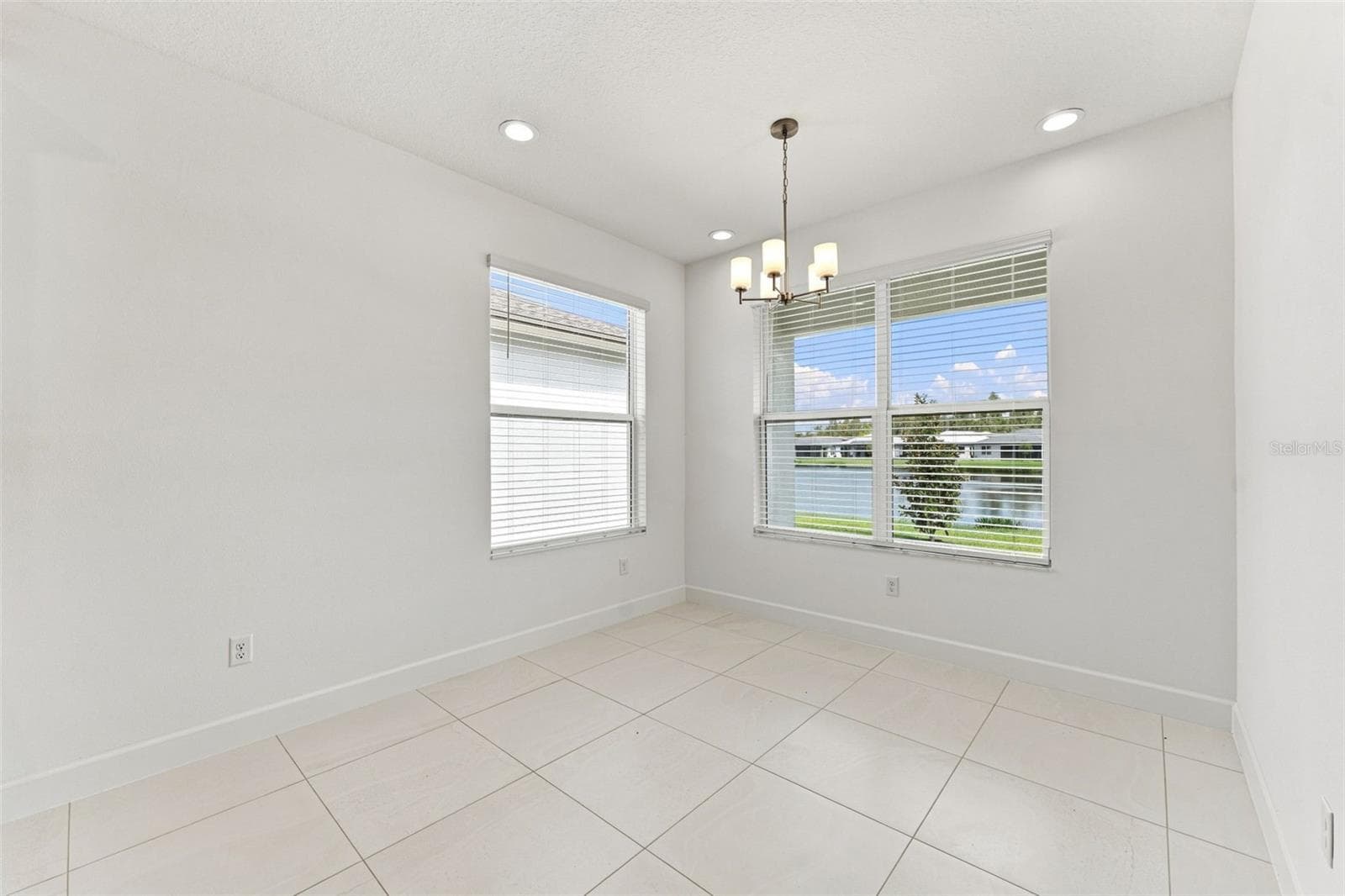Dedicated Dining Space With Water Views & Lots of Natural Lighting - 3427 MALTA AVE, WESLEY CHAPEL
