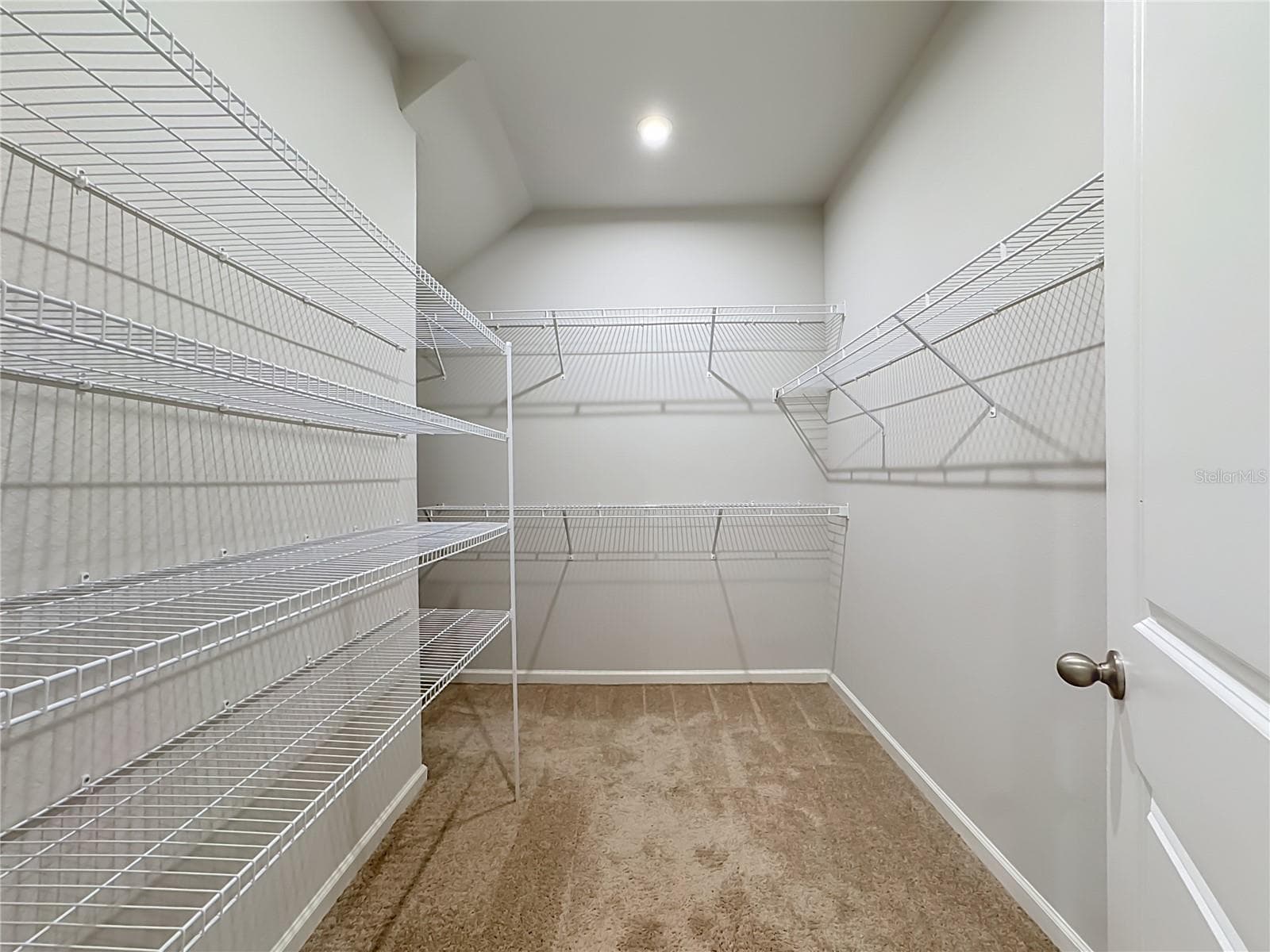 Primary Walk-in closet - 5517 COACHWOOD CV, BRADENTON