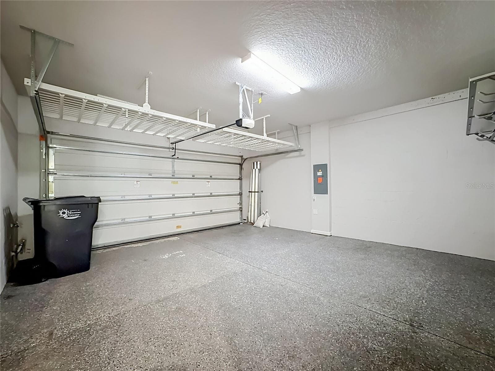 Garage door opener & storage Shelving - 5517 COACHWOOD CV, BRADENTON