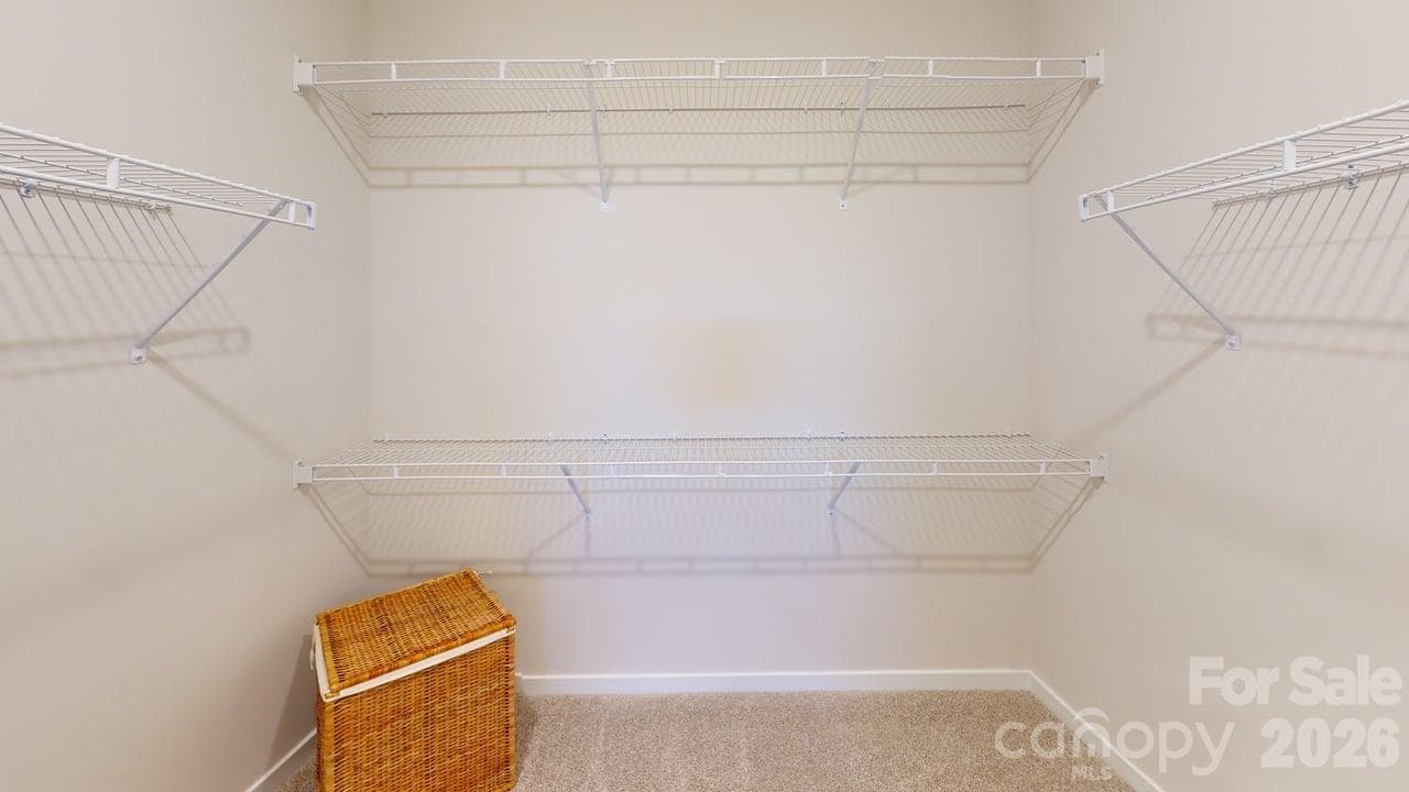 PHOTO IS REPRESENTATIONAL - Primary bedroom walk-in closet - 4219 S New Hope Road, Gastonia