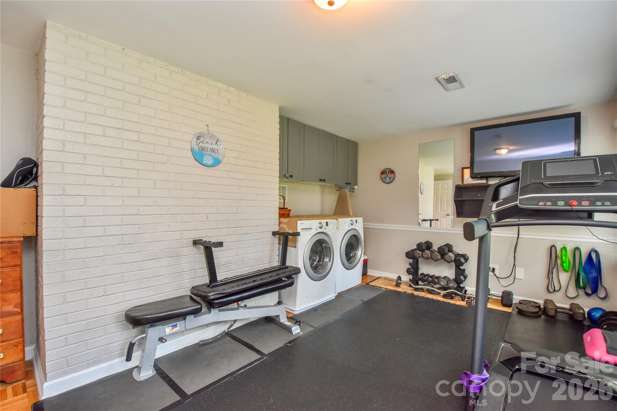 Laundry is found in the bonus room. - 127 Fairway Drive, Mooresville