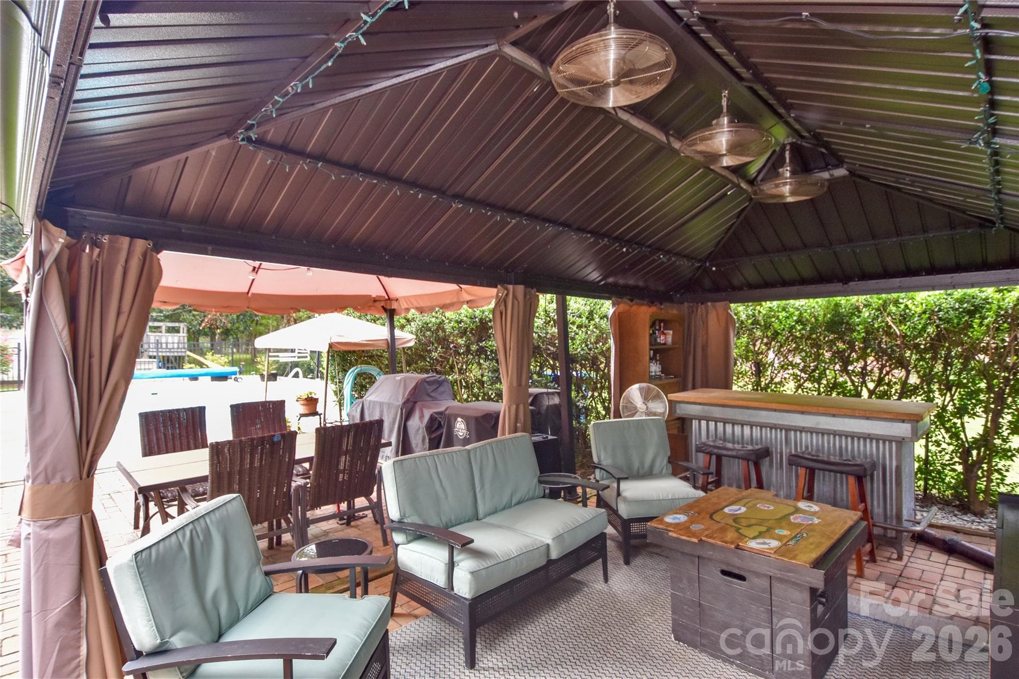 Sturdy outdoor covering perfect to escape the sun or weather and still enjoy the outdoors. - 127 Fairway Drive, Mooresville