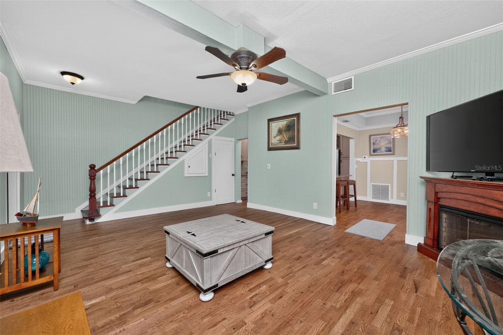 Parlor view of kitchen and dining door ways, closet under stairs for additional storage - 502 W MARION AVE, PUNTA GORDA